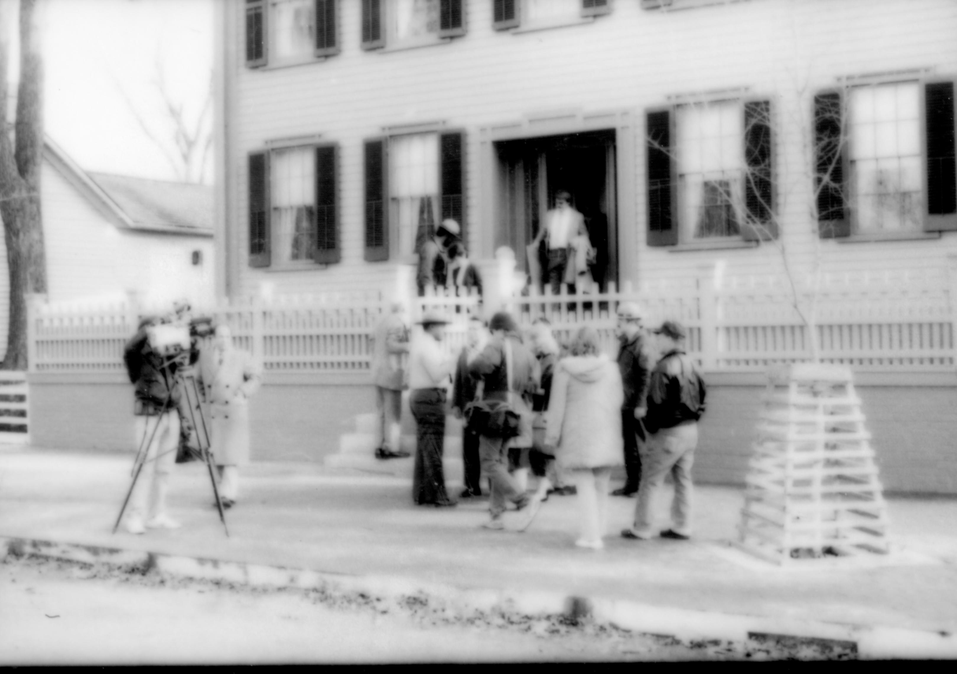 People standing on sidewalk in front of house. Lincoln Home NHS- Durbin and Simon, 79 Durbin, Simon, visit, media