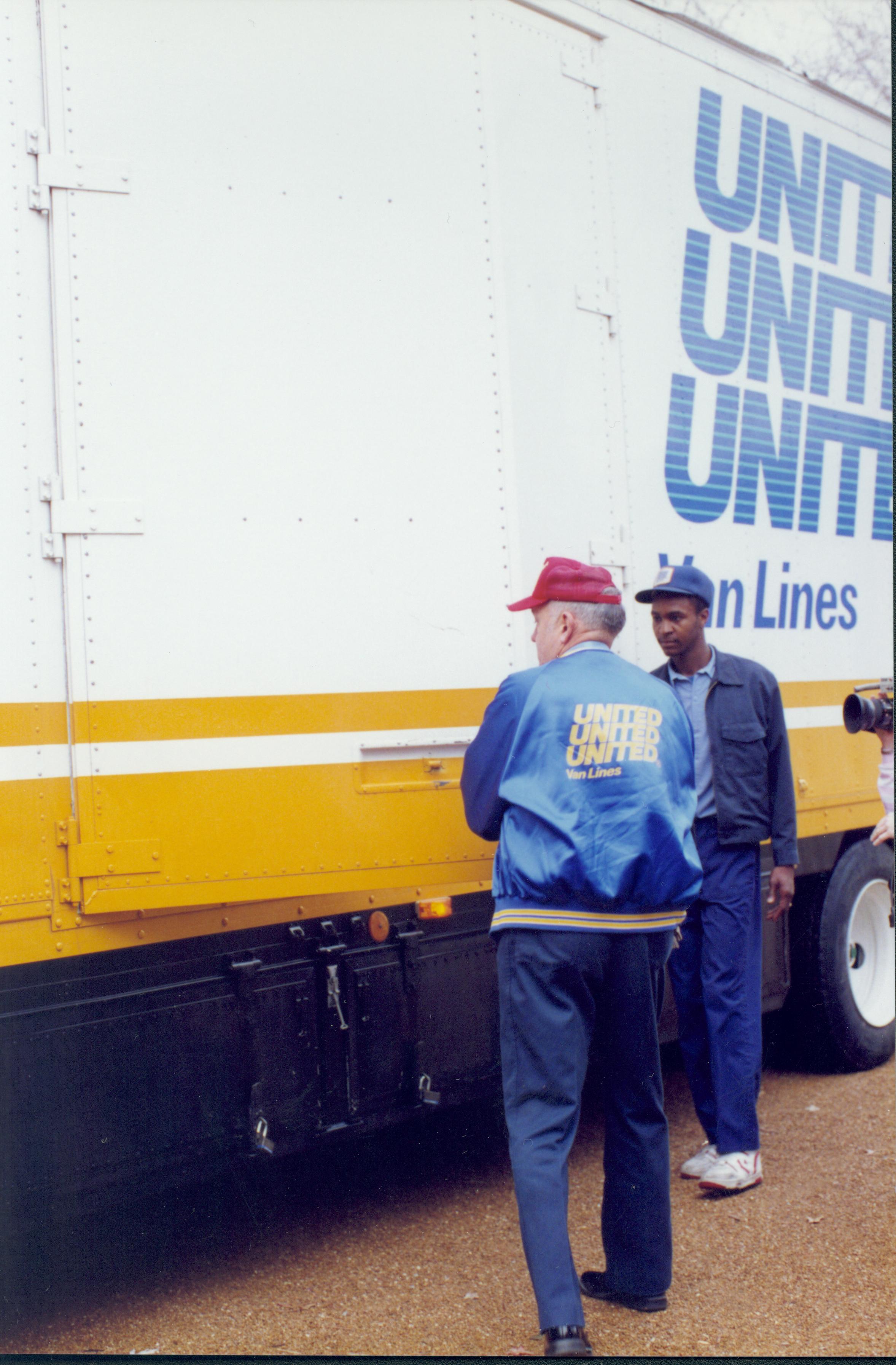 Two men standing by moving van. Lincoln Home NHS- Bring Furniture Back Home furniture, movers