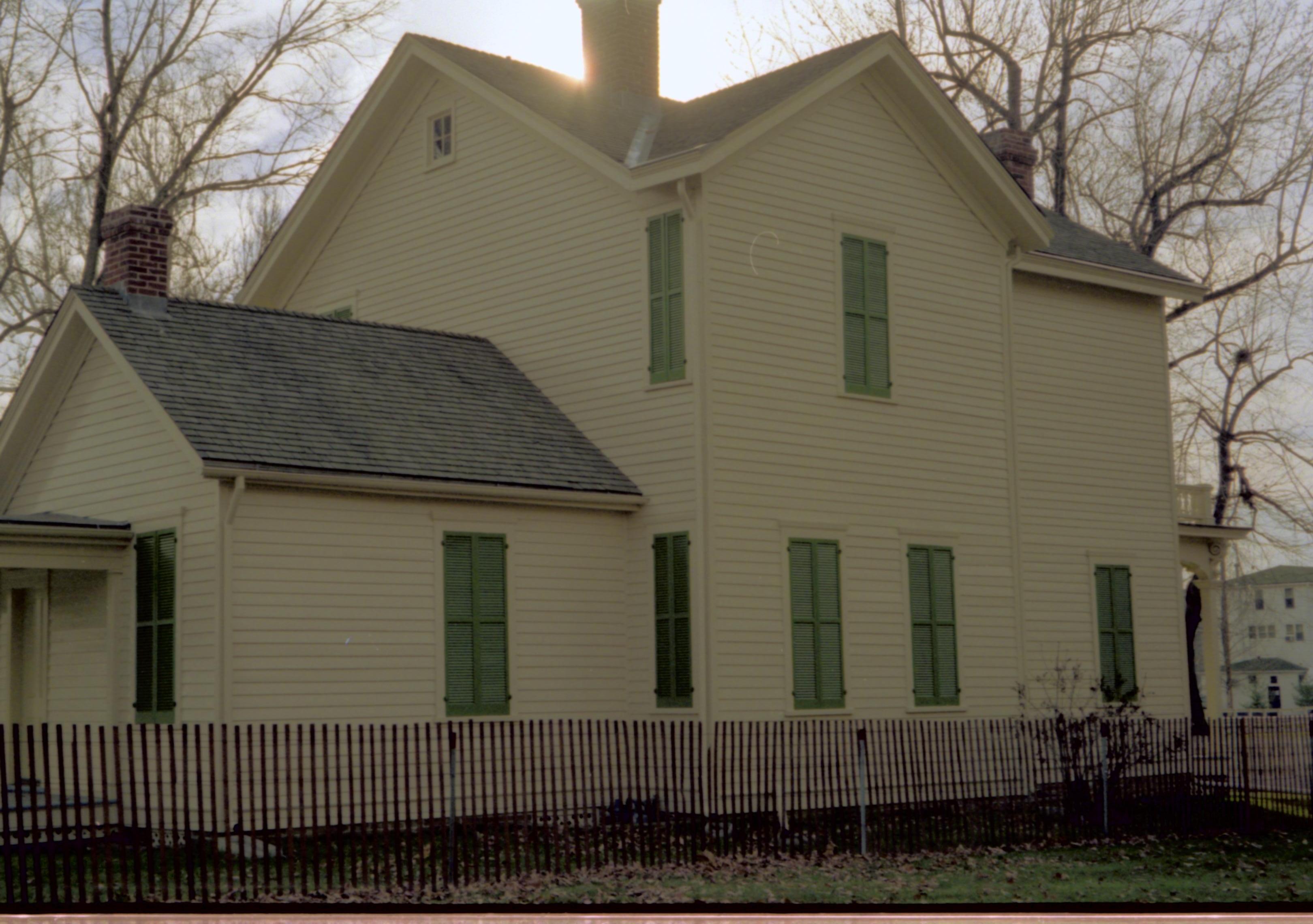 Side view of yellow house. Lincoln Home NHS- Bring Furniture Back Home, 79A Robinson