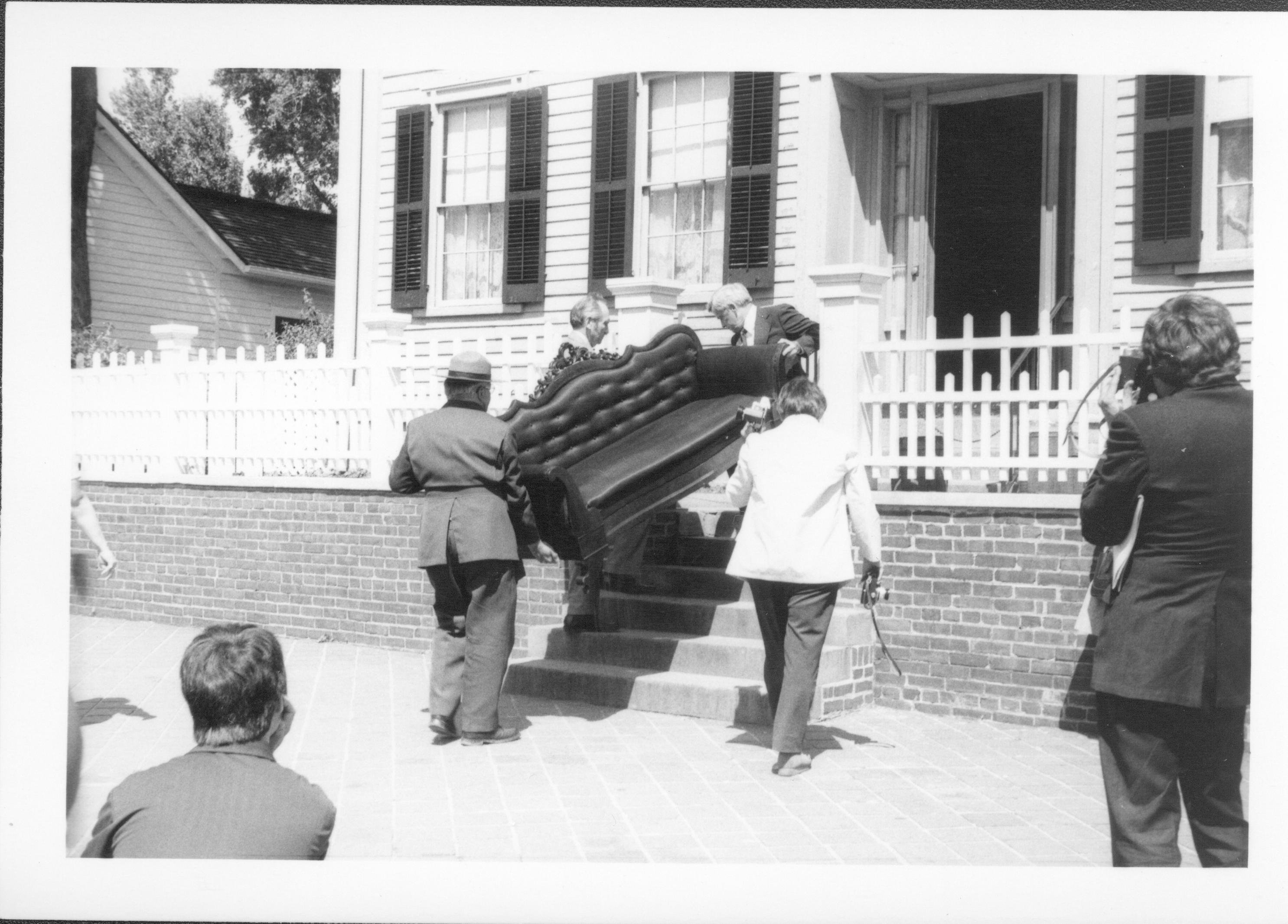 Sofa being carried up steps. Lincoln Home NHS- Bring Furniture Back Home, class #1190 furniture, return