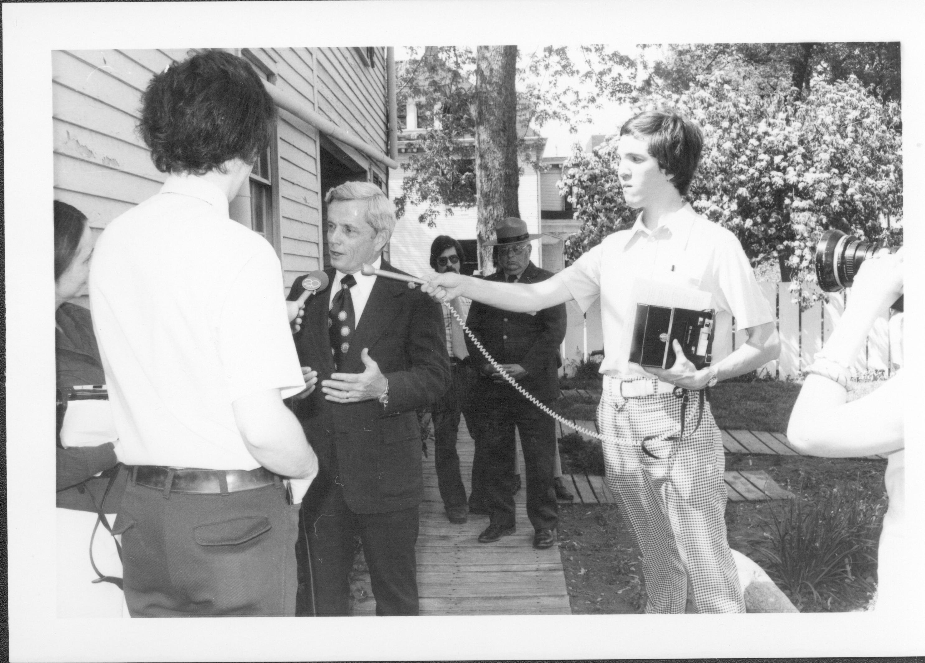 Man being interviewed. Lincoln Home NHS- Bring Furniture Back Home, neg #29 class #1000, class 8 pic 29 furniture, return