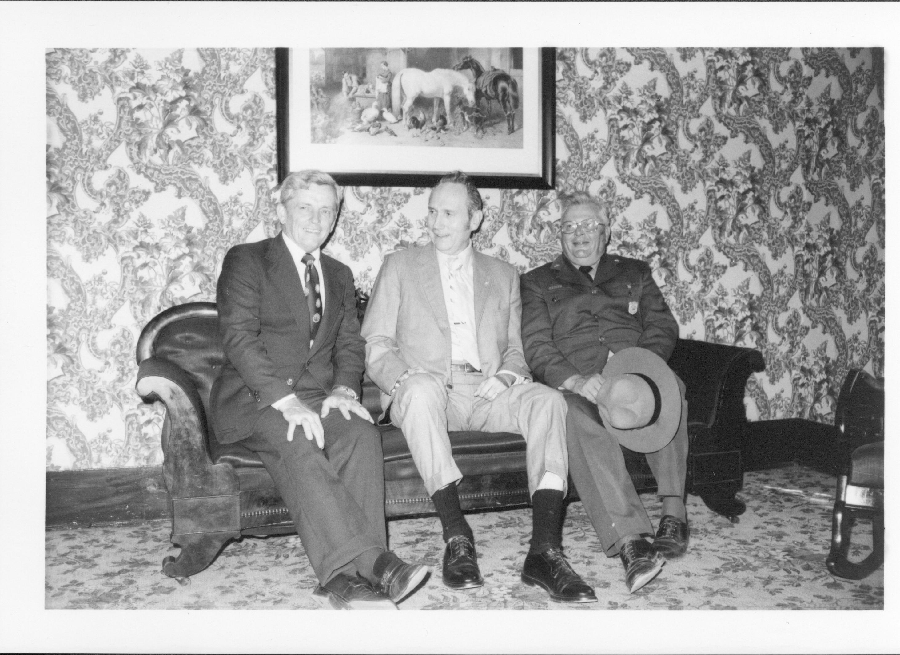 Three men sitting on a sofa. Lincoln Home NHS- Bring Furniture Back Home, neg #17 class #1190, class 8 pic 17 furniture, move