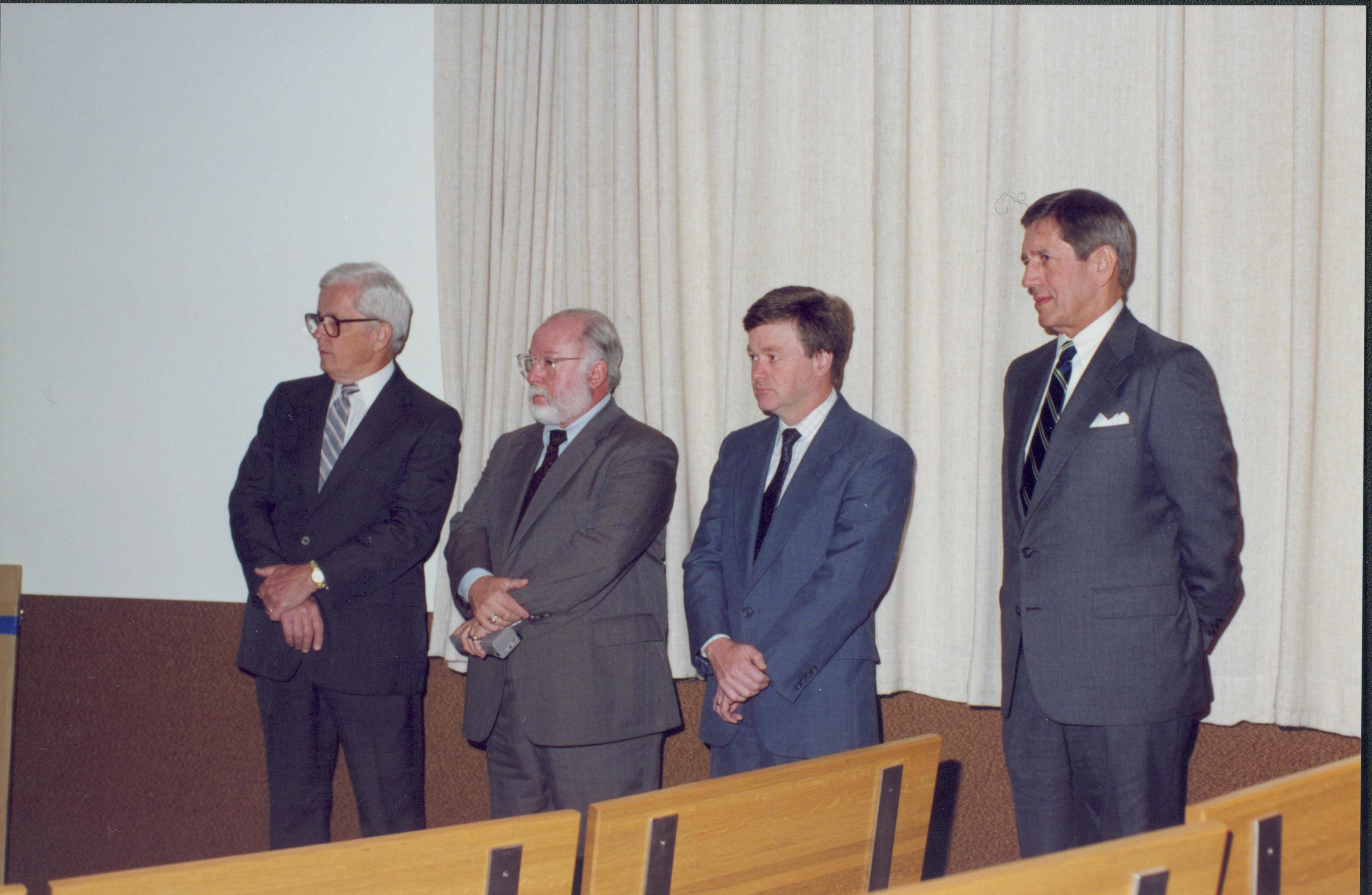 Four men standing in front of curtain. Lincoln Home NHS- Bring Furniture Back Home ceremony, presentation