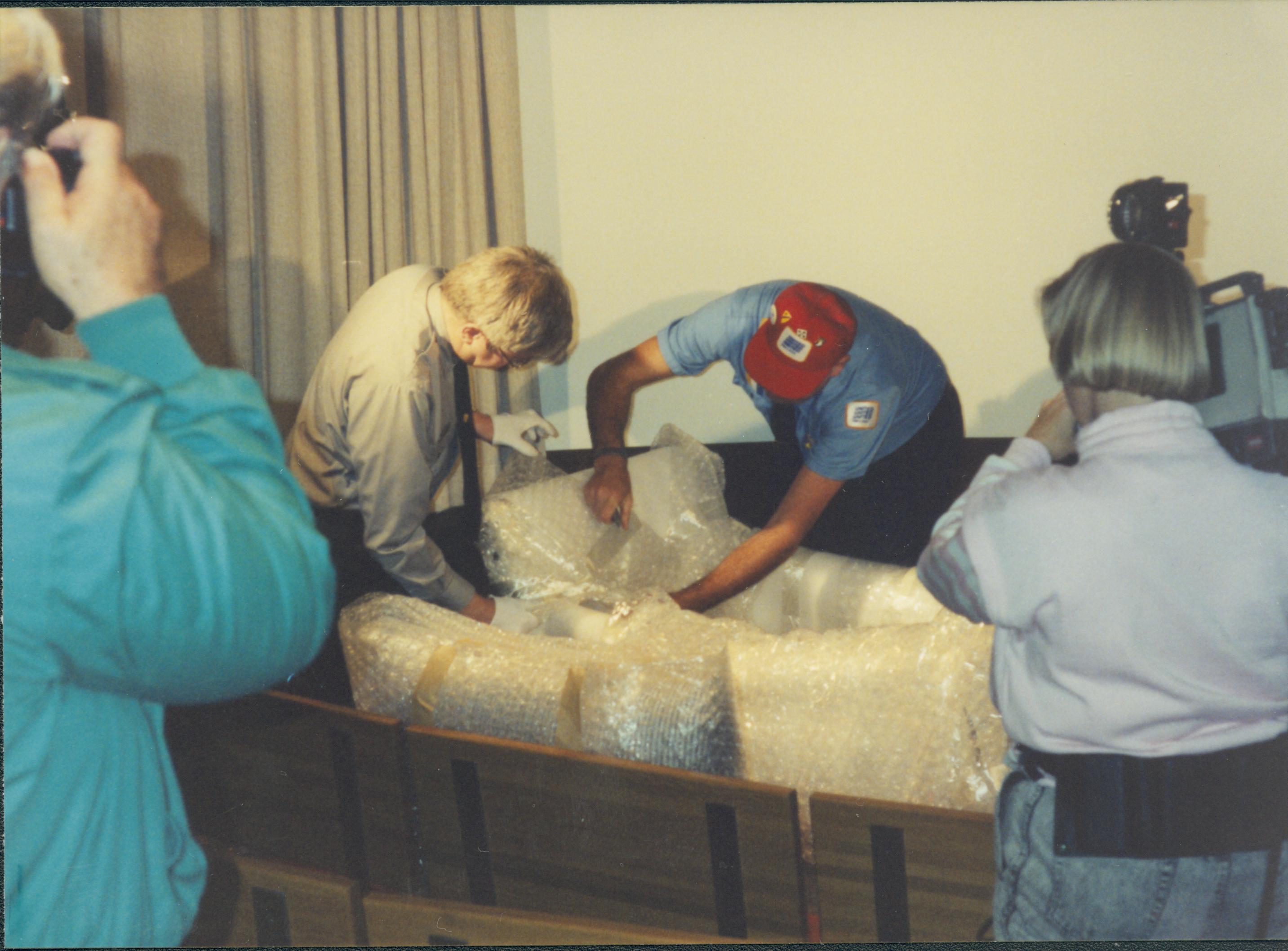 Men unpacking furniture. Lincoln Home NHS- Bring Furniture Back Home, 313194 furniture