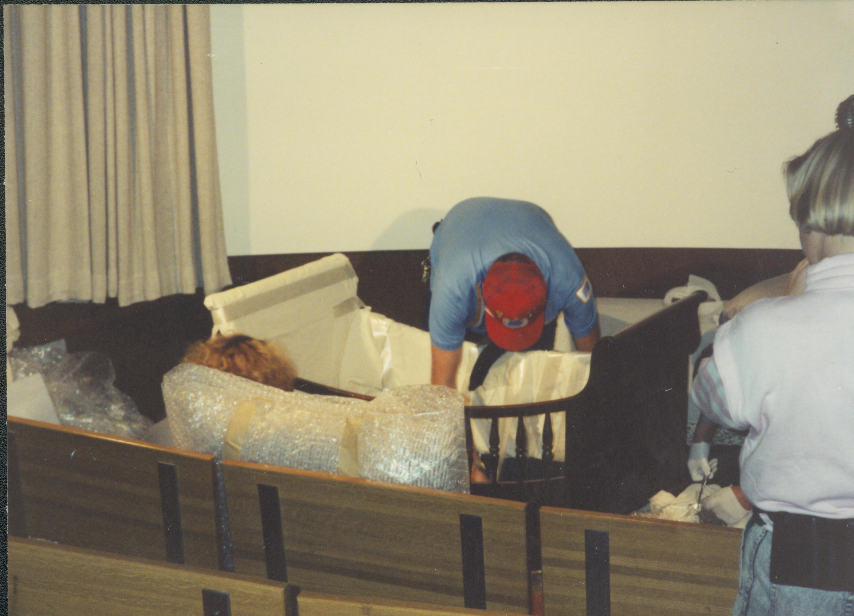 Men unpacking furniture. Lincoln Home NHS- Bring Furniture Back Home, 313194 furniture