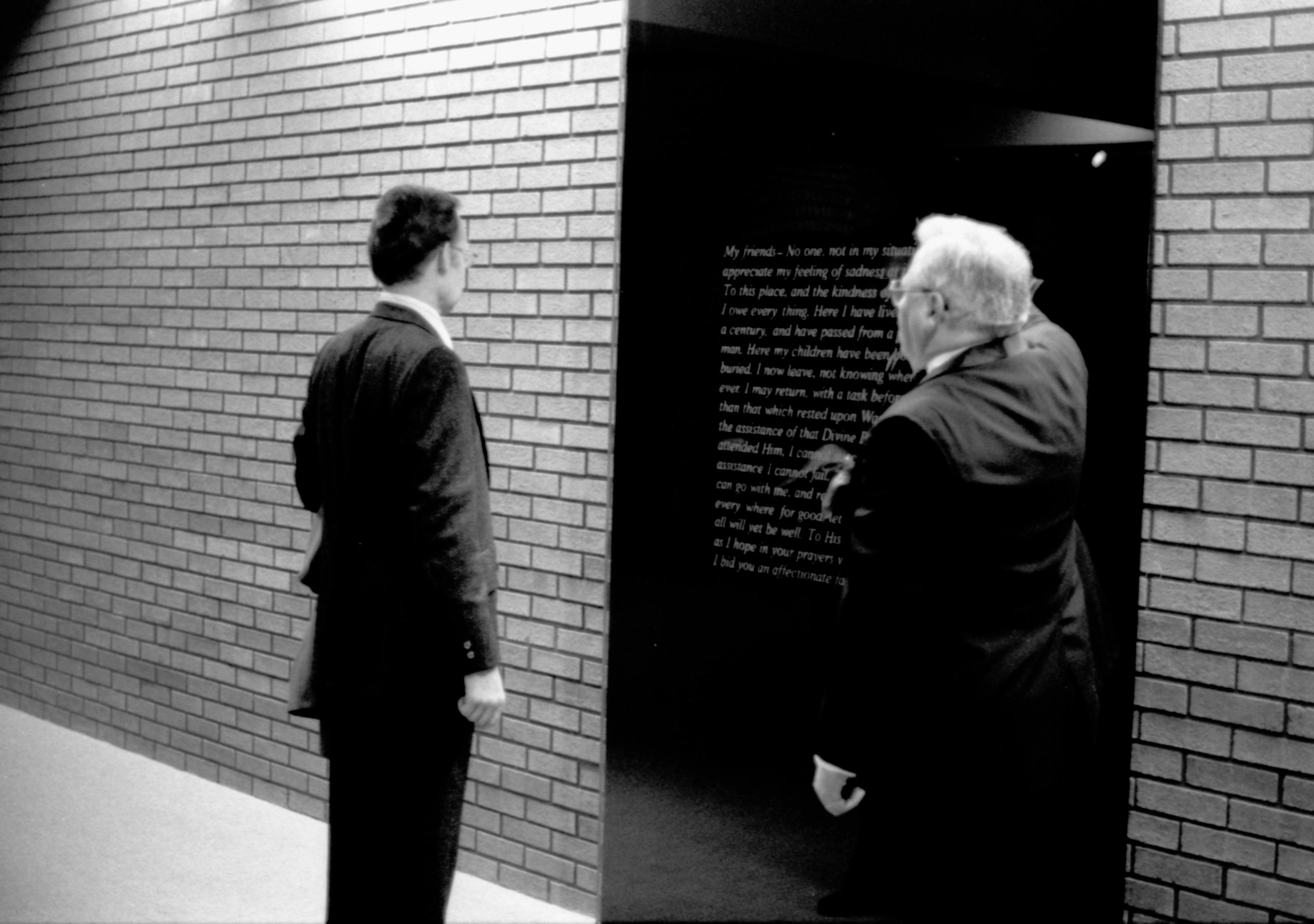 Two men reading plaque on wall. Lincoln Home NHS- Paul Findley visit to LIHO Finley, visit, banquet, ceremony