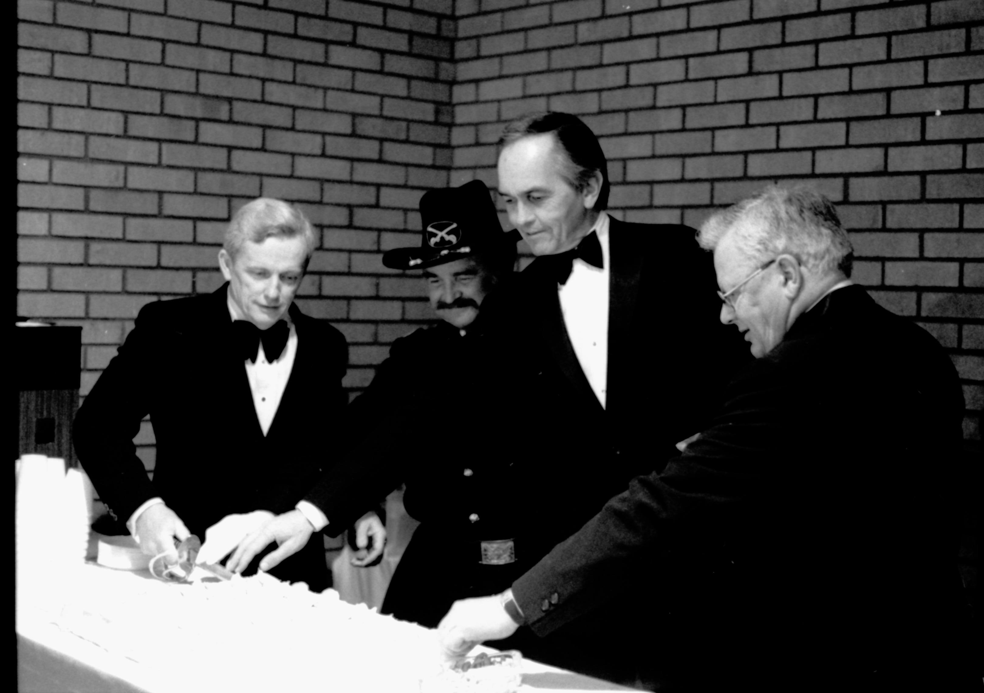 Four men, one in Civil War uniform. Lincoln Home NHS- Paul Findley visit to LIHO Finley, visit, reception