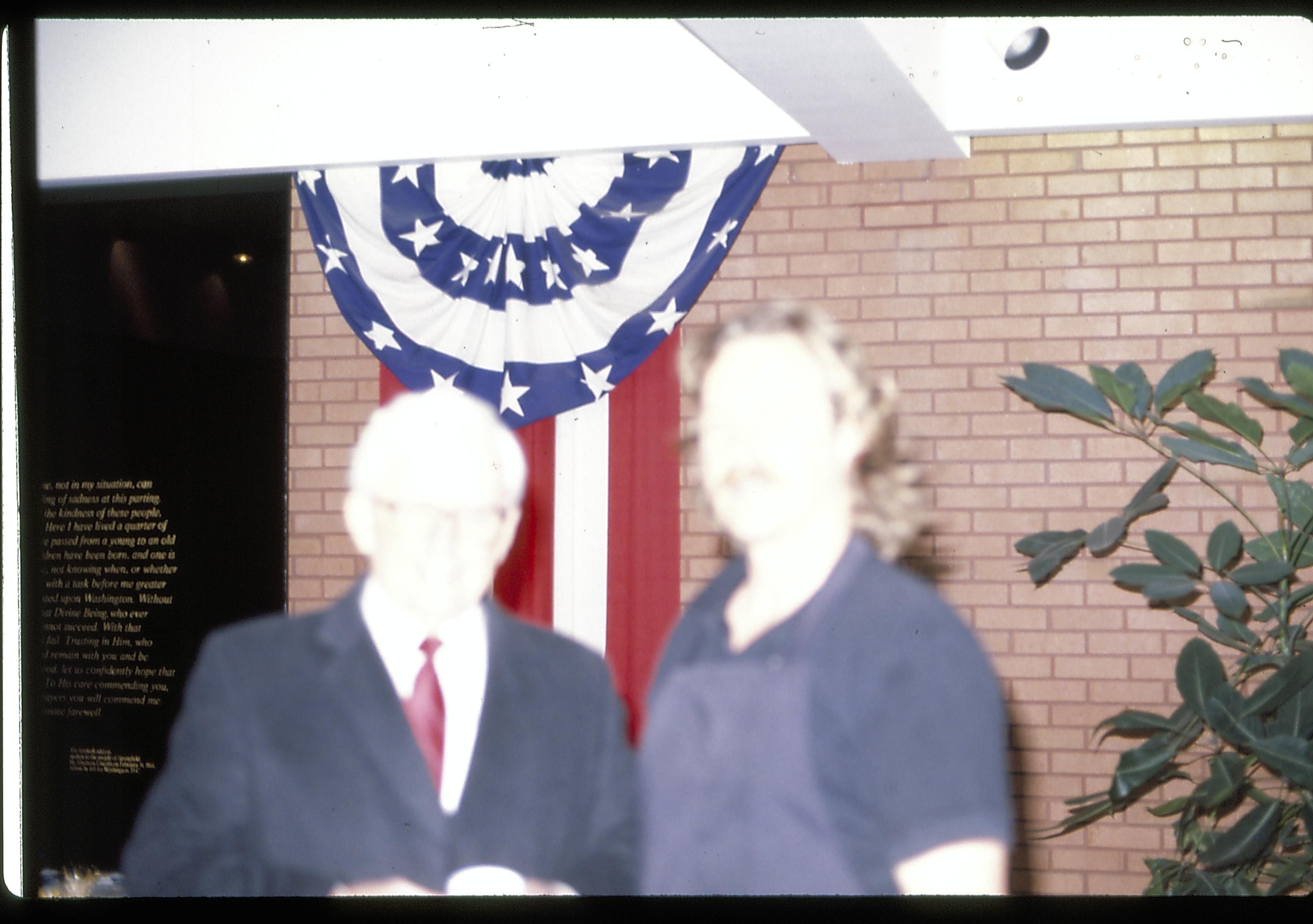 Two men standing in front of red, white & blue bunting. Lincoln Home NHS- Paul Findley Recognition Award Finley, award