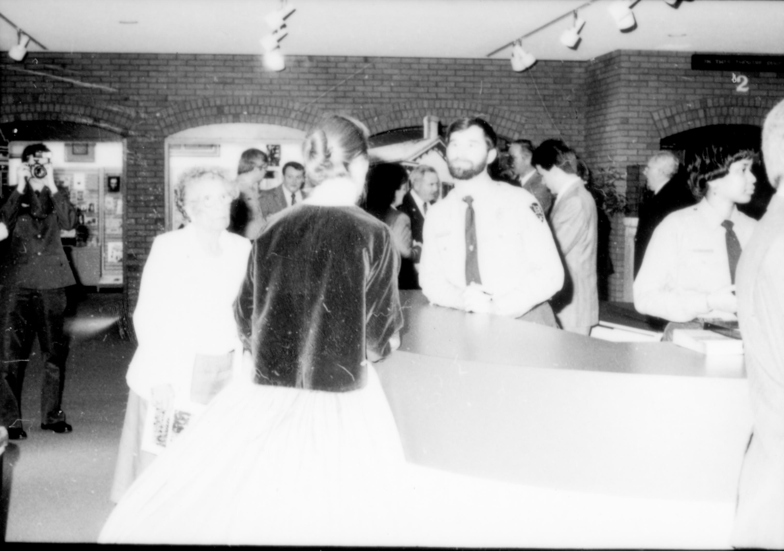 Group of visitors around information desk. Lincoln Home NHS- Paul Findley and Michel VIP visit, 121 Finley, Michel, visit, reception