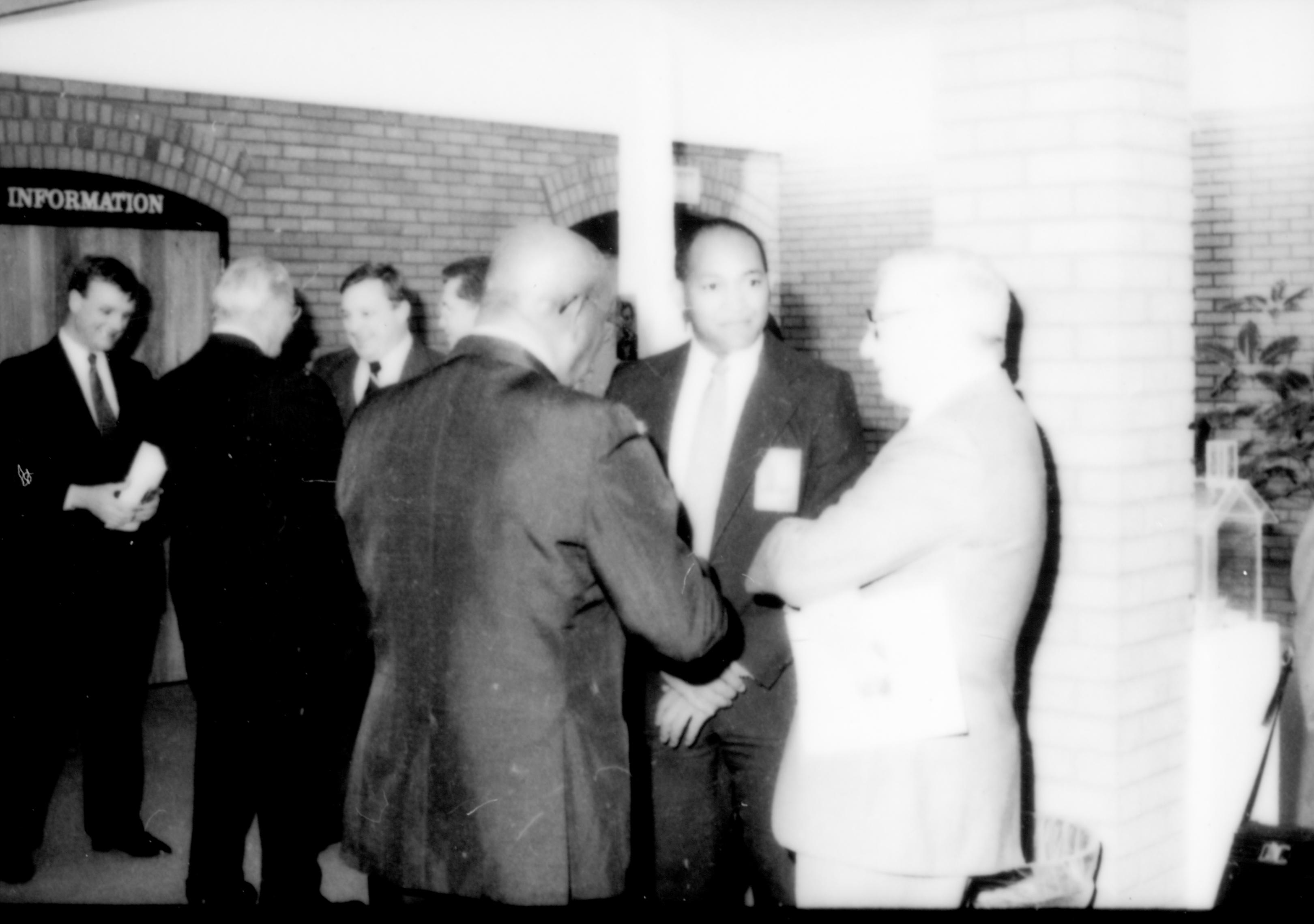 Three men in forefront talking. Lincoln Home NHS- Paul Findley and Michel VIP visit, 122 Finley, Michel, visit, reception