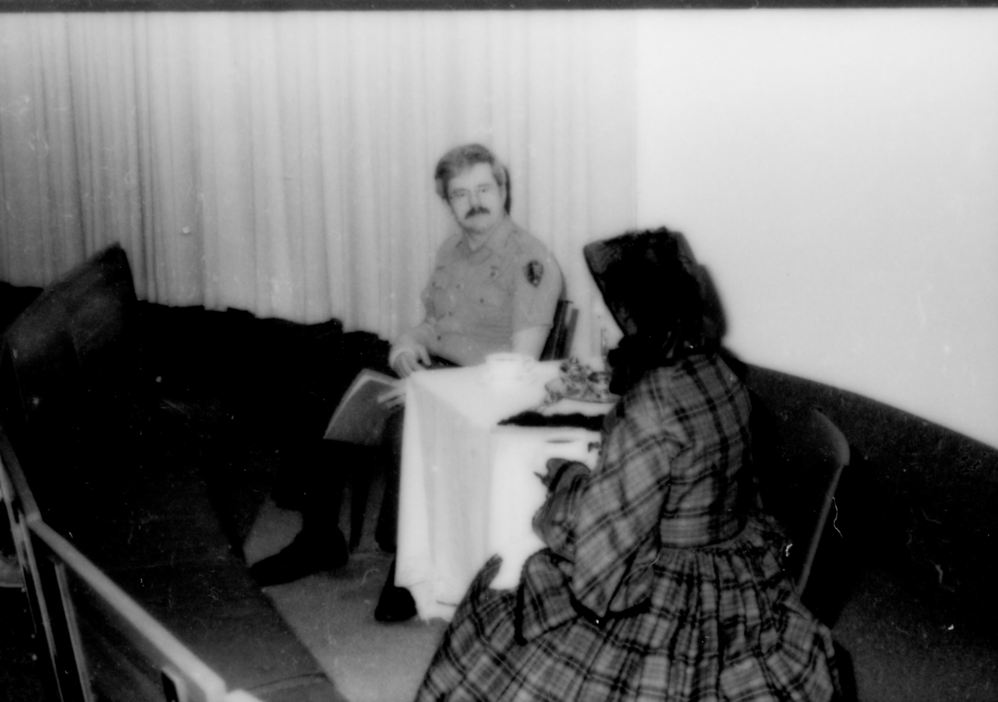 Two people sittting at table in front of screen. Lincoln Home NHS- Paul Findley and Michel VIP visit, 123 Finley, Michel, visit, reception
