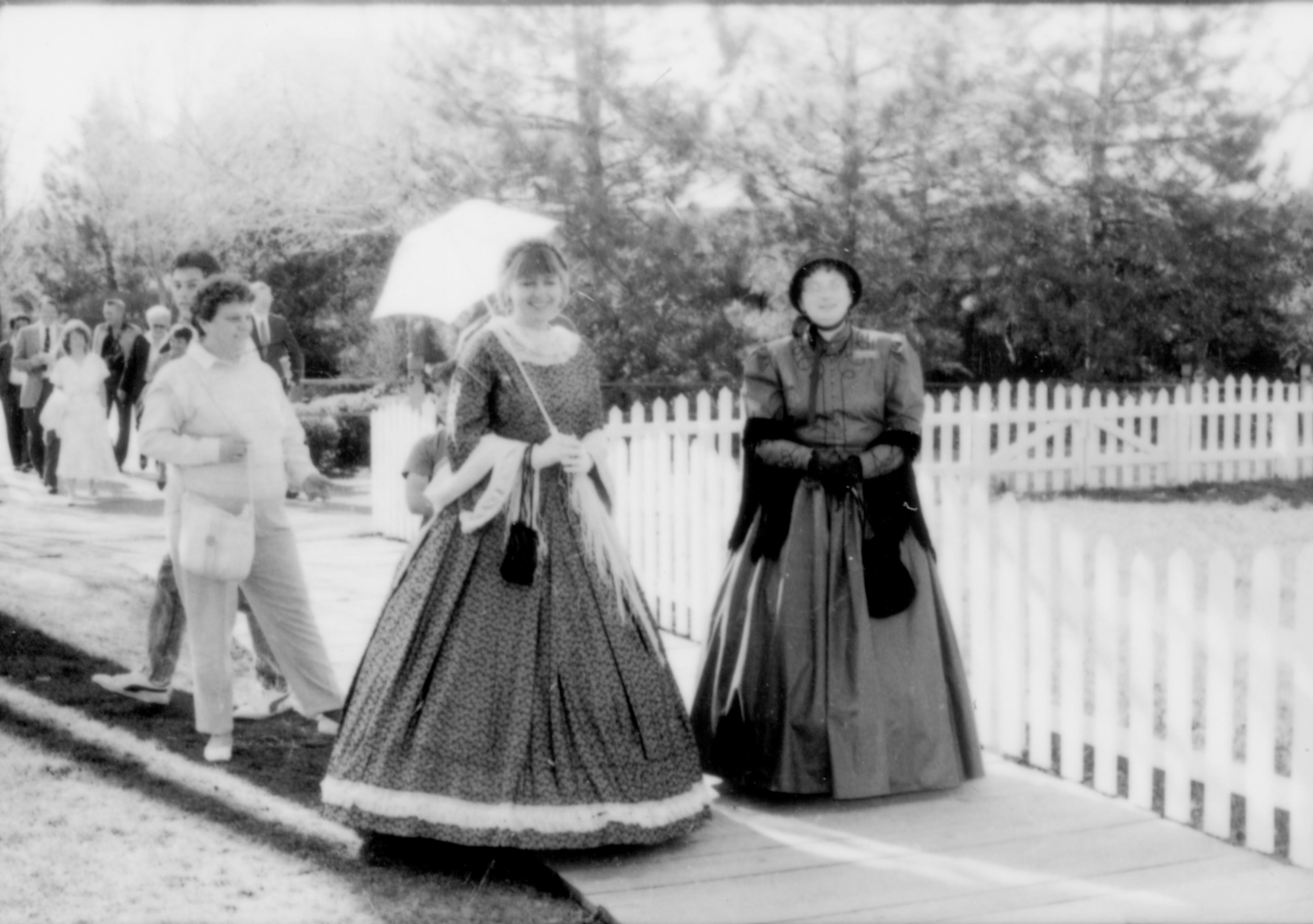 Two ladies in period dress on board walk Lincoln Home NHS- Paul Findley and Michel VIP visit, 123 Finley, Michel, visit
