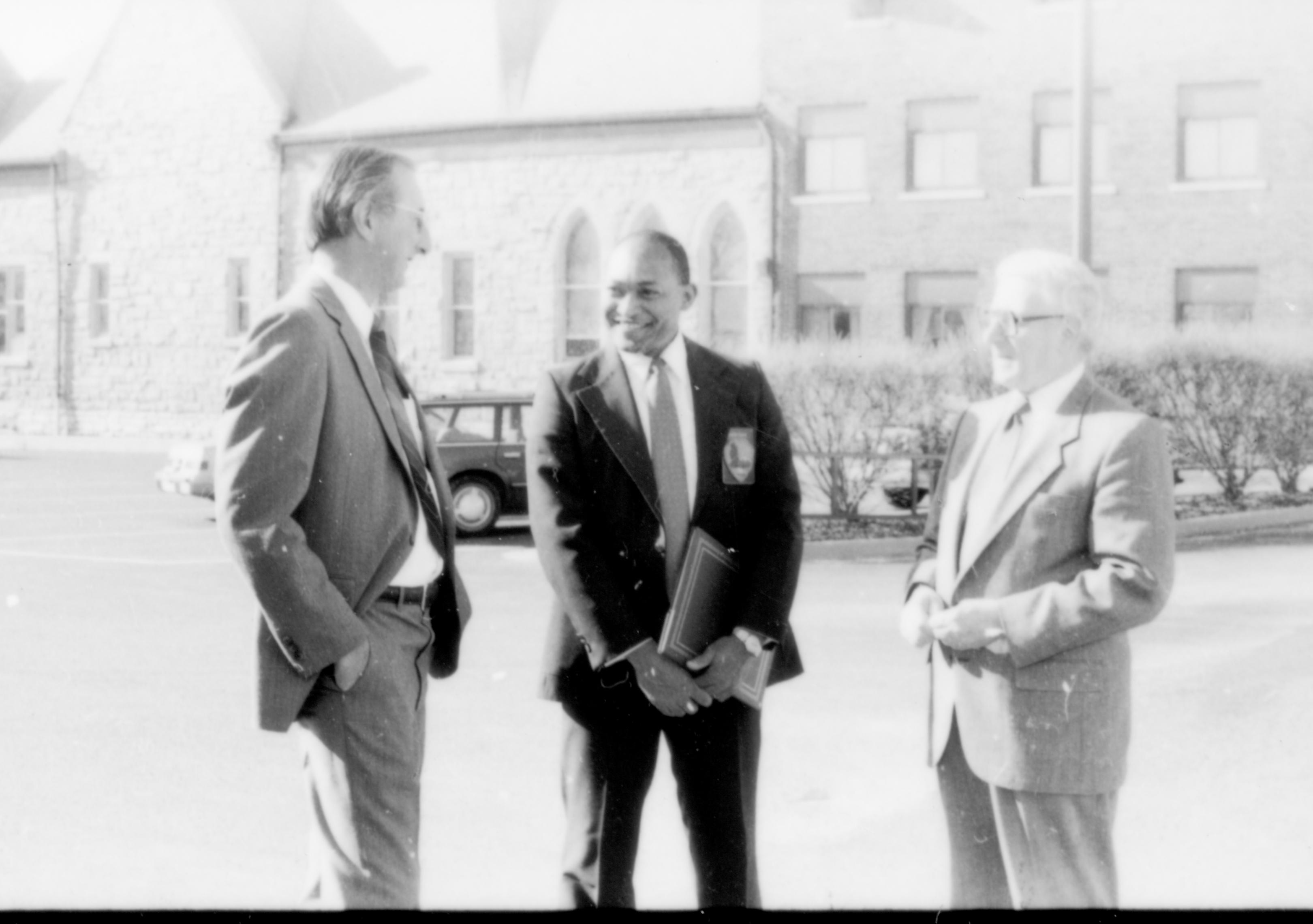 Three men standing, talking. Lincoln Home NHS- Paul Findley and Michel VIP visit, 123 Finley, Michel, visit