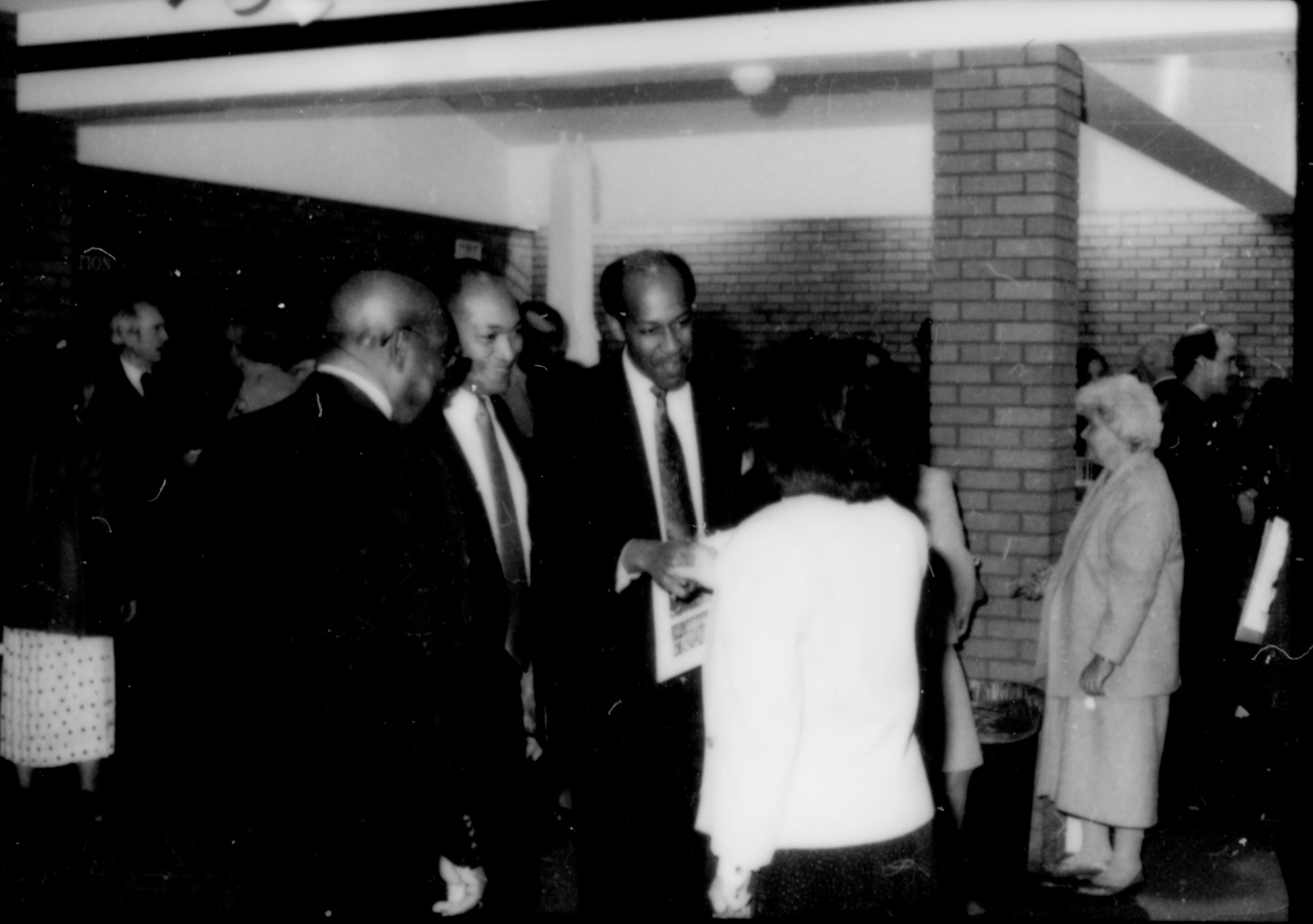 Three men talking to lady in white coat. Lincoln Home NHS- Paul Findley and Michel VIP visit, 125 Finley, Michel, visit