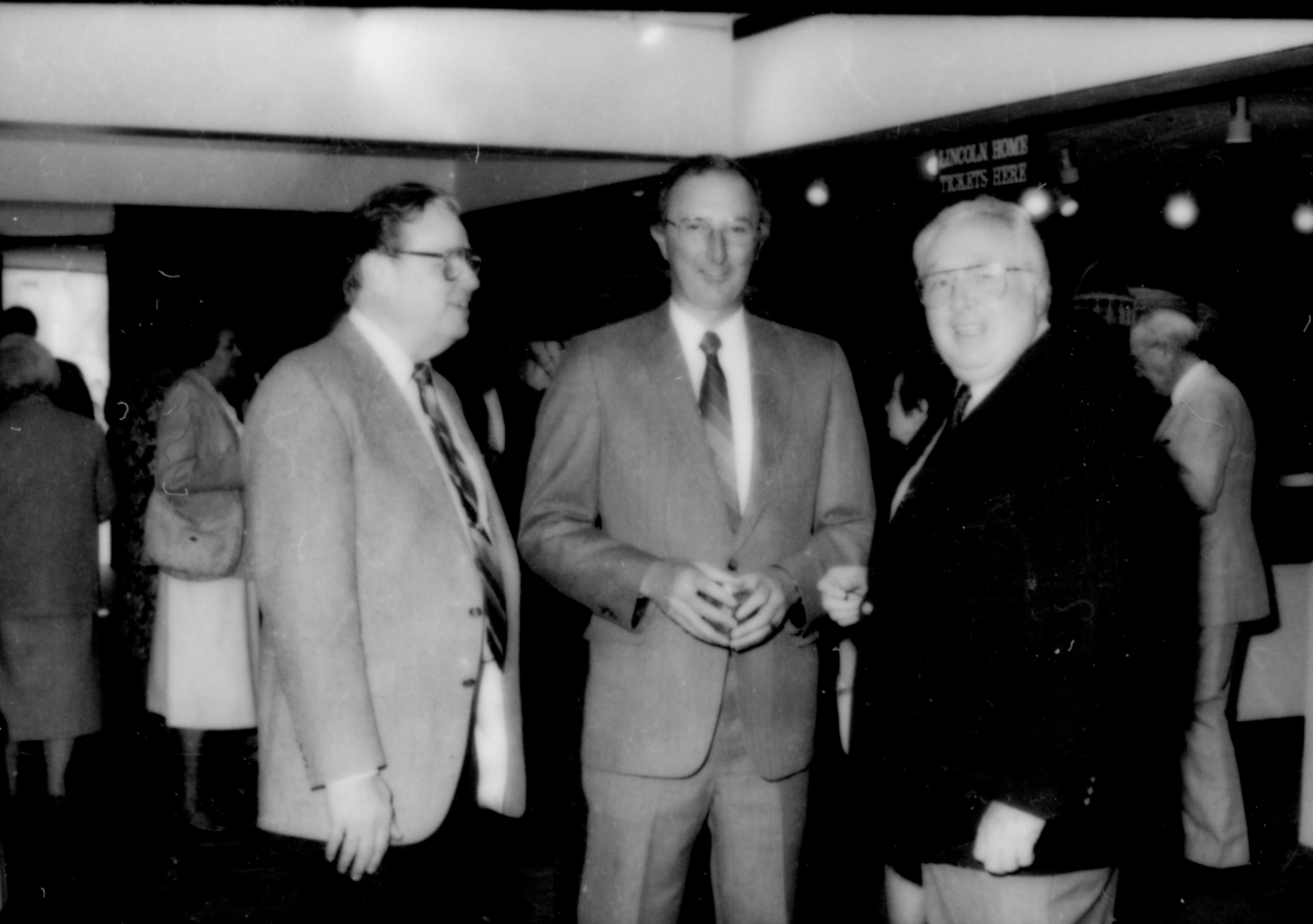 Three men standing, talking. Lincoln Home NHS- Paul Findley and Michel VIP visit, 125 Finley, Michel, visit