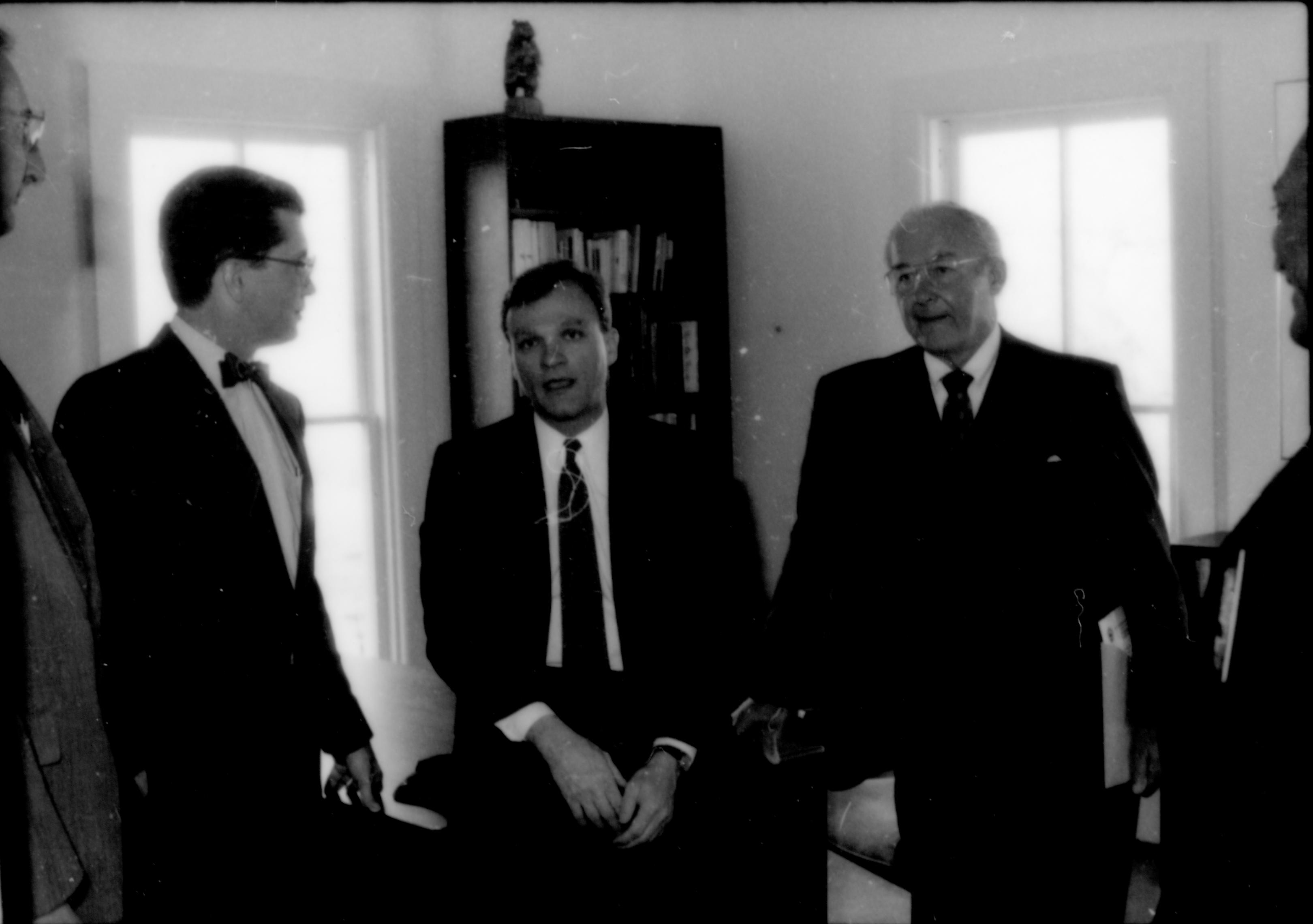 Three men standing in front of deak. Lincoln Home NHS- Paul Findley and Michel VIP visit, 115 Finley, Michel, tour, visit