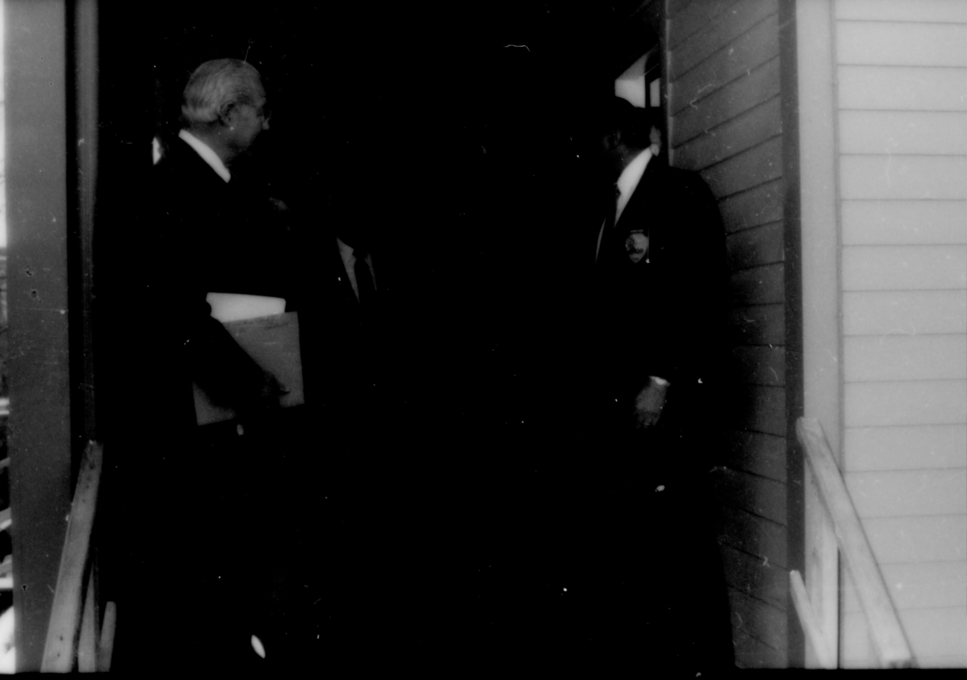 Two men standing on steps. Lincoln Home NHS- Paul Findley and Michel VIP visit, 127 Finley, Michel, visit, program