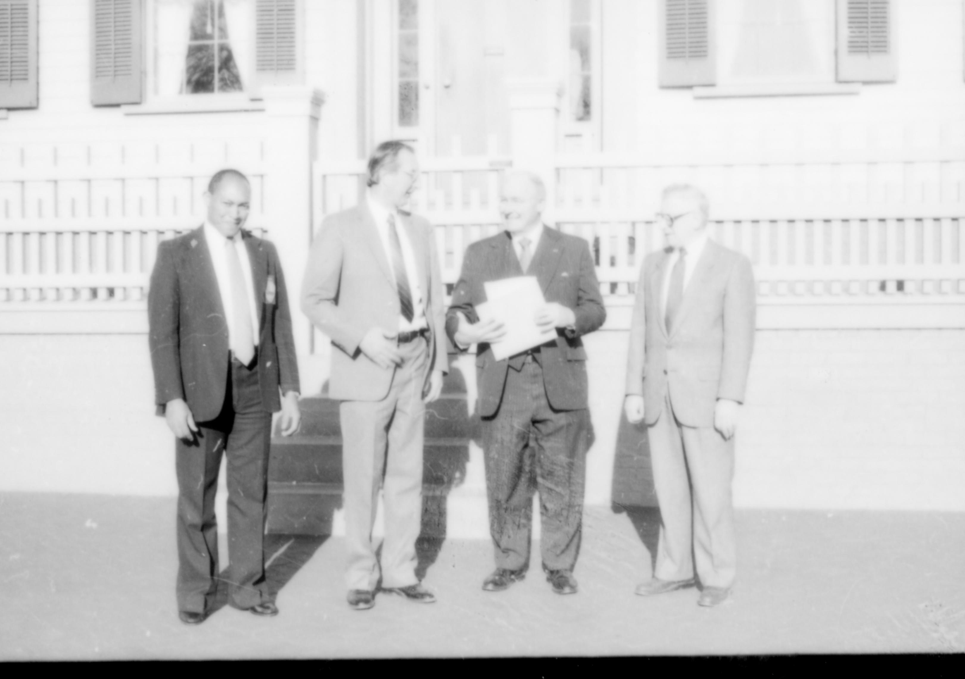 Four men standing in front of Lincoln home. Lincoln Home NHS- Paul Findley and Michel VIP visit, 127 Finley, Michel, visit, tour