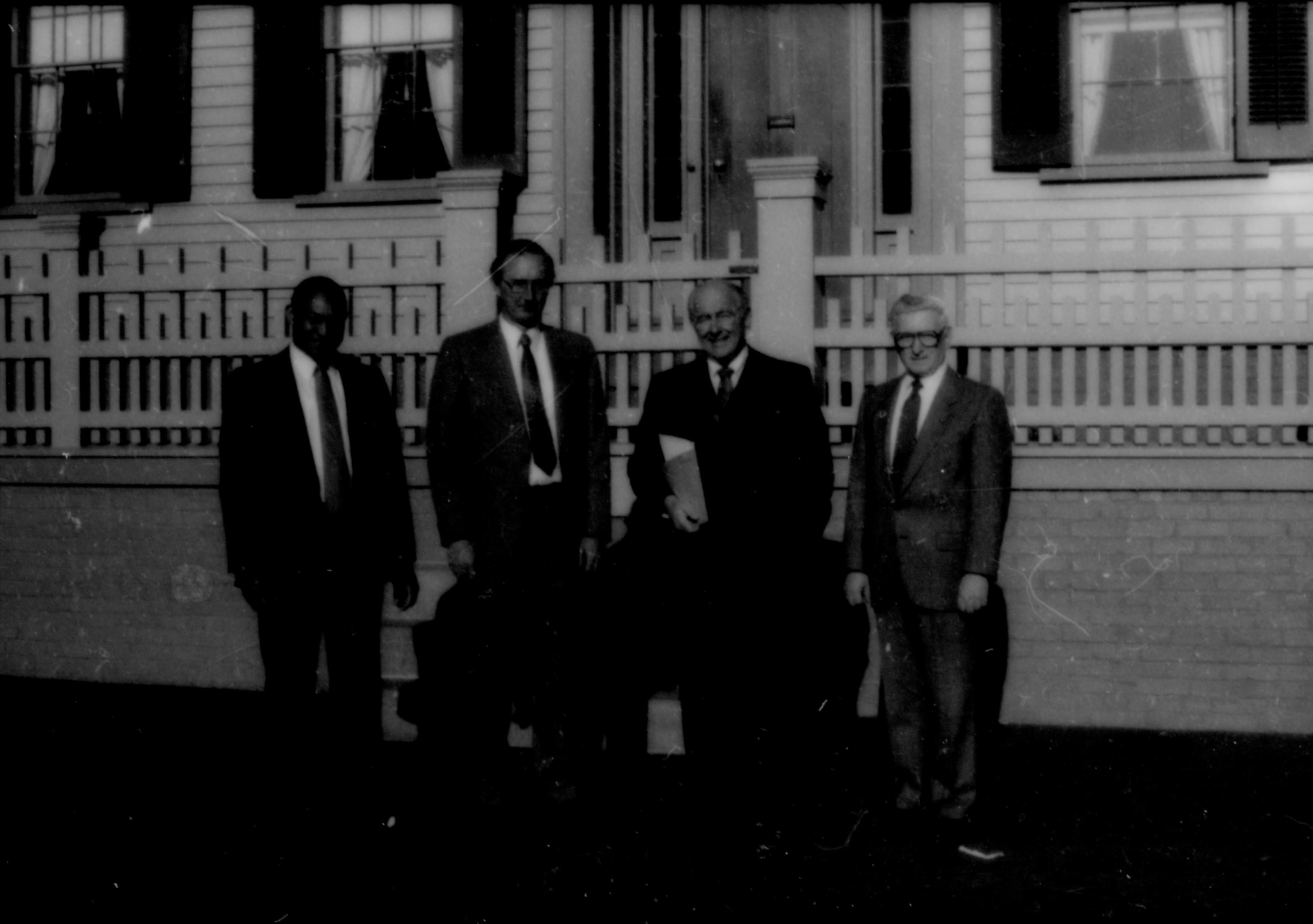 Four men standing in front of Home. Lincoln Home NHS- Paul Findley and Michel VIP visit, 128 Finley, Michel, visit, tour