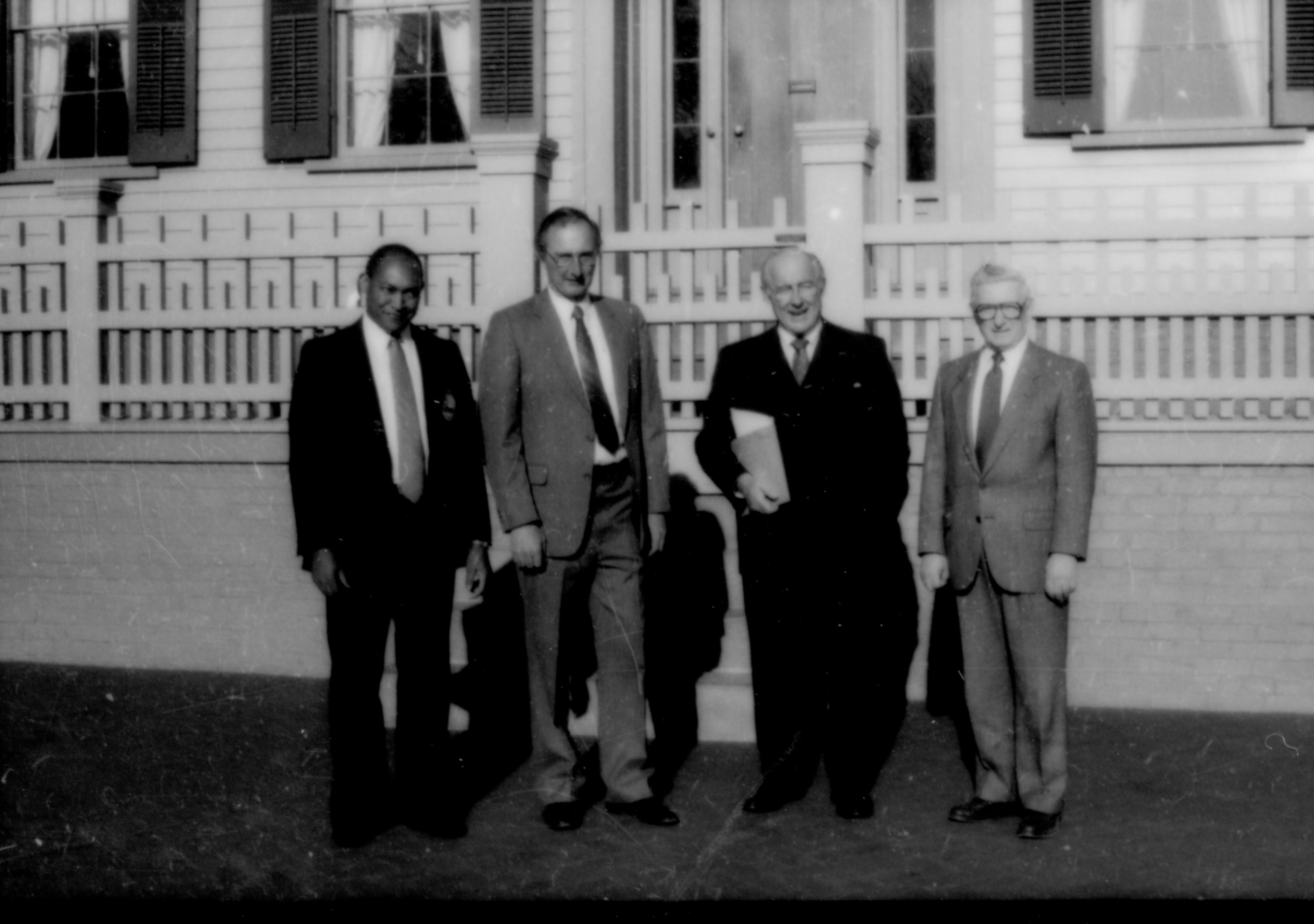 Four men standing in front of Home. Lincoln Home NHS- Paul Findley and Michel VIP visit, 128 Finley, Michel, visit, tour