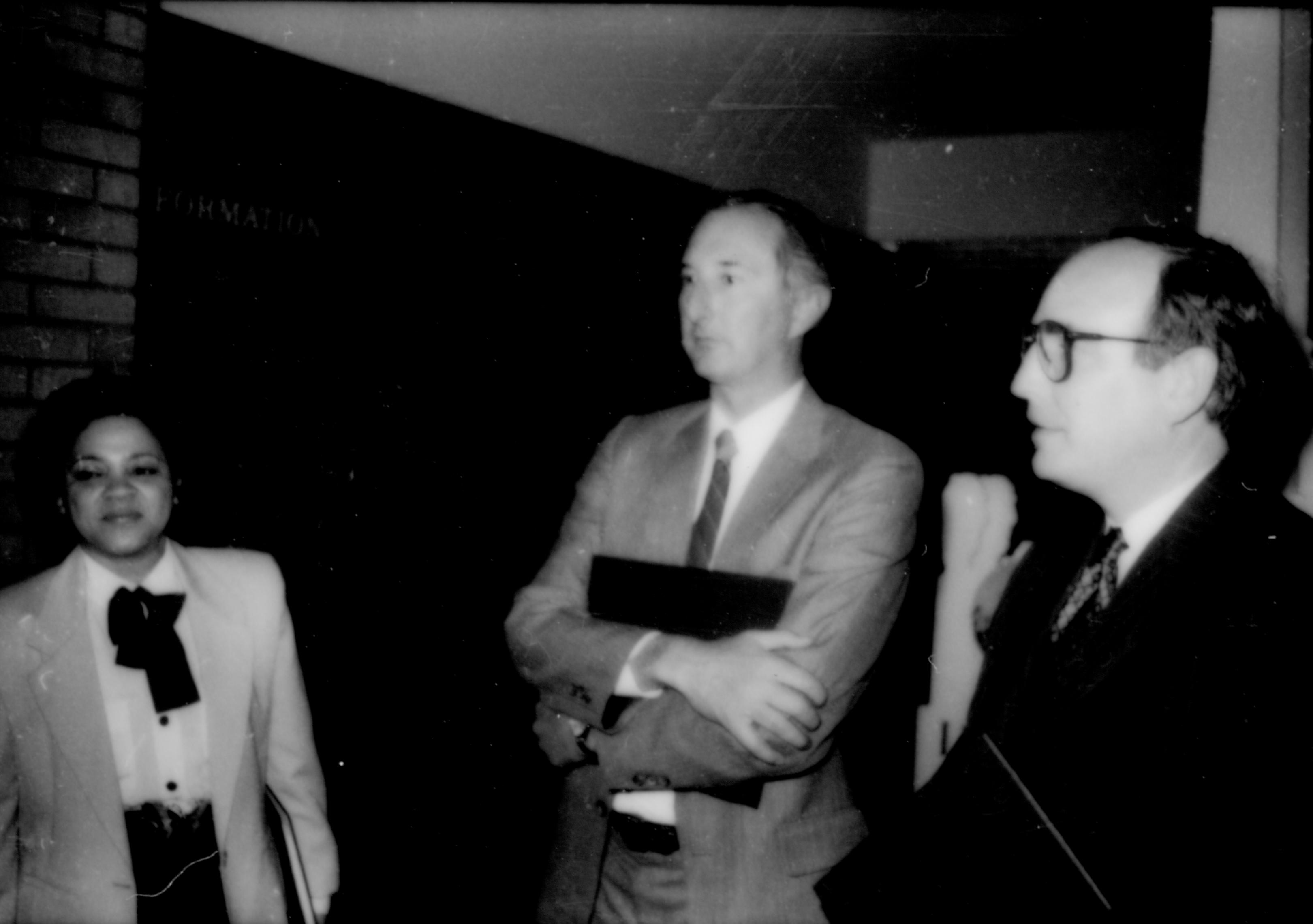 Lady and two men standing holding folders. Lincoln Home NHS- Paul Findley and Michel VIP visit, 129 Finley, Michel, visit, reception