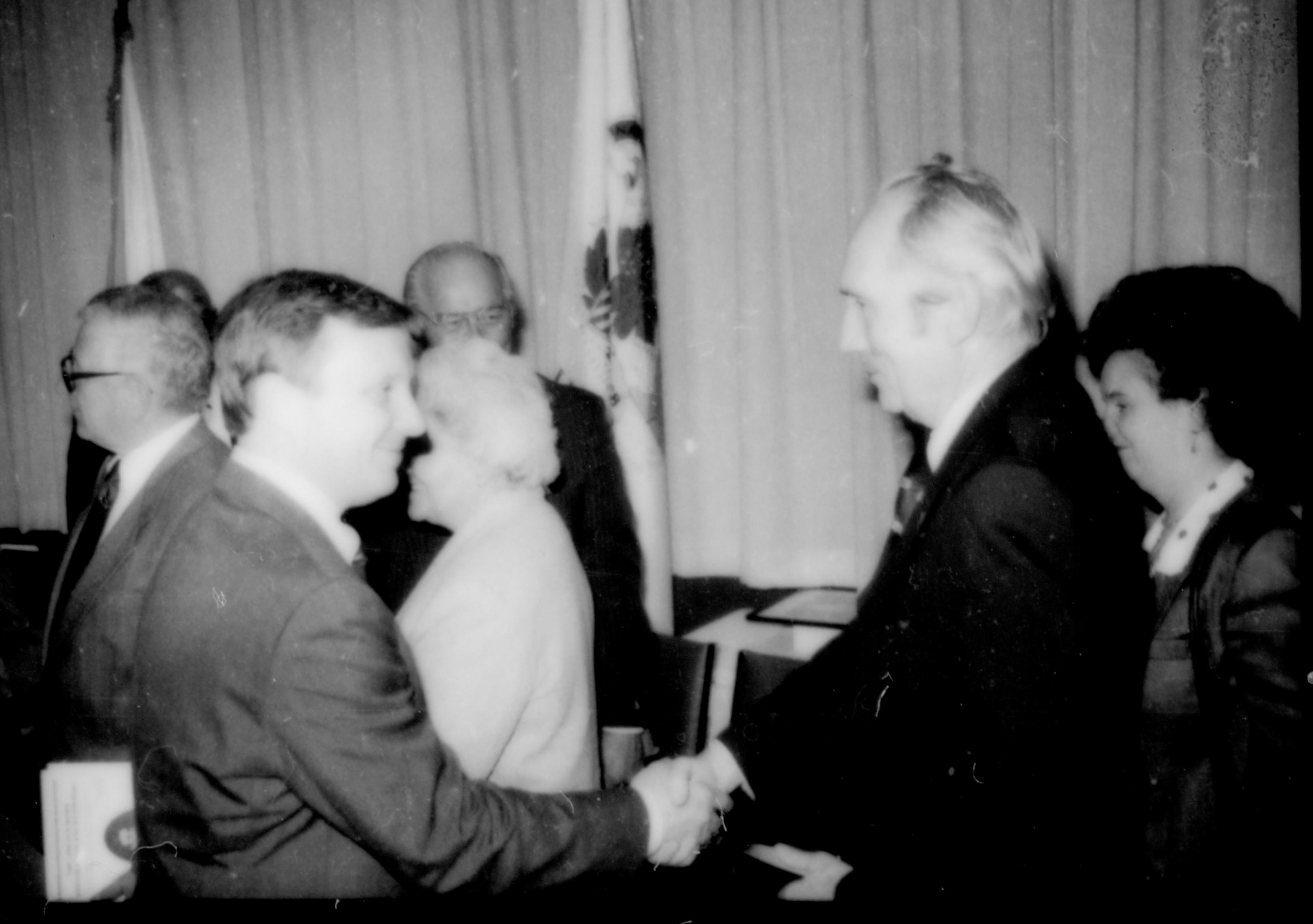Two men shaking hands (in a group). Lincoln Home NHS- Paul Findley and Michel VIP visit, 130 Finley, Michel, visit, program