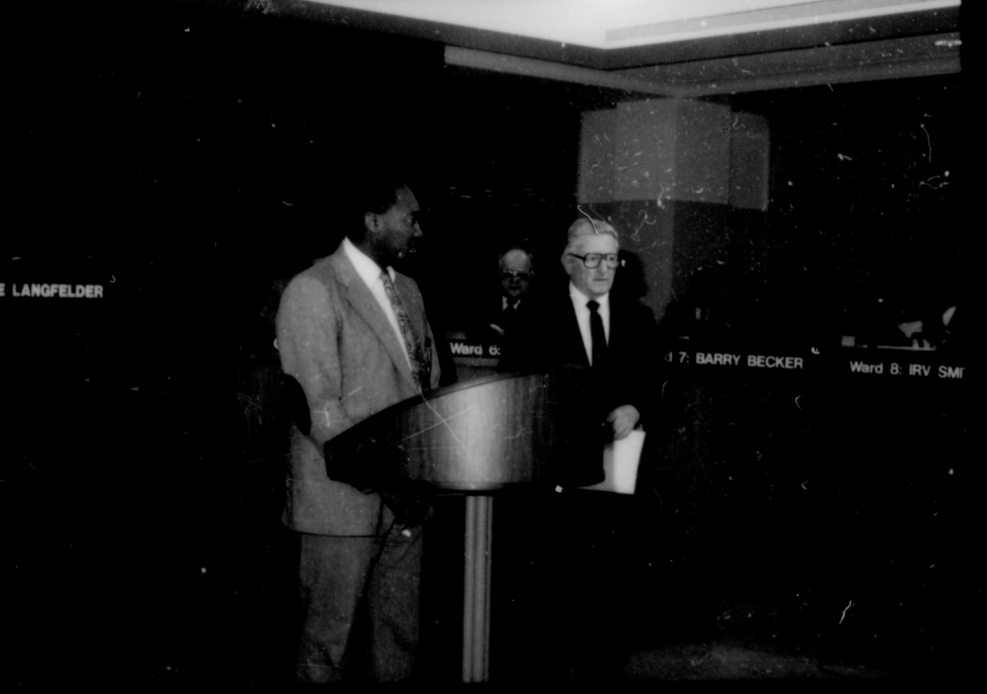 Two men standing at podium. Lincoln Home NHS- City Council Ollie Christmas Award, 133 Award, program