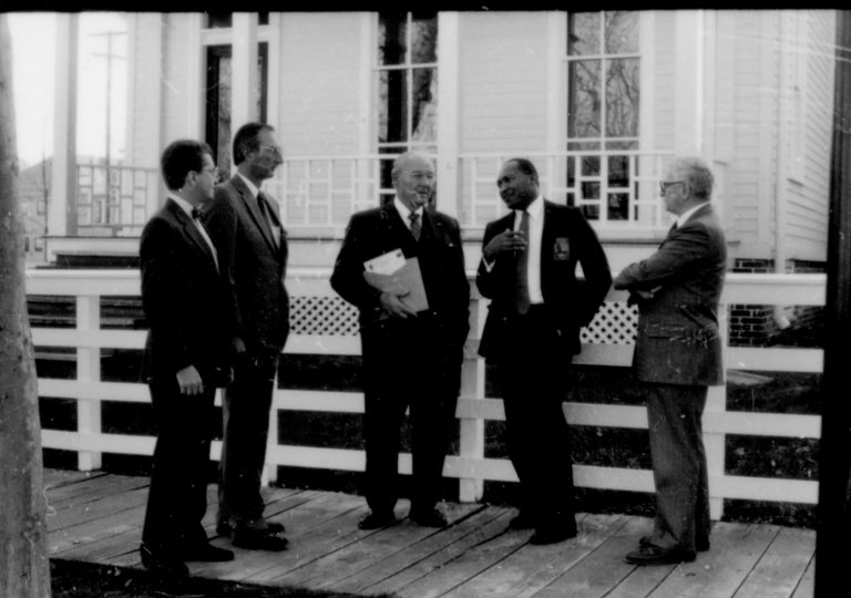 Men standing by white fence. Lincoln Home NHS- Paul Findley and Michel VIP visit, 115 Finley, Michel, tour, visit