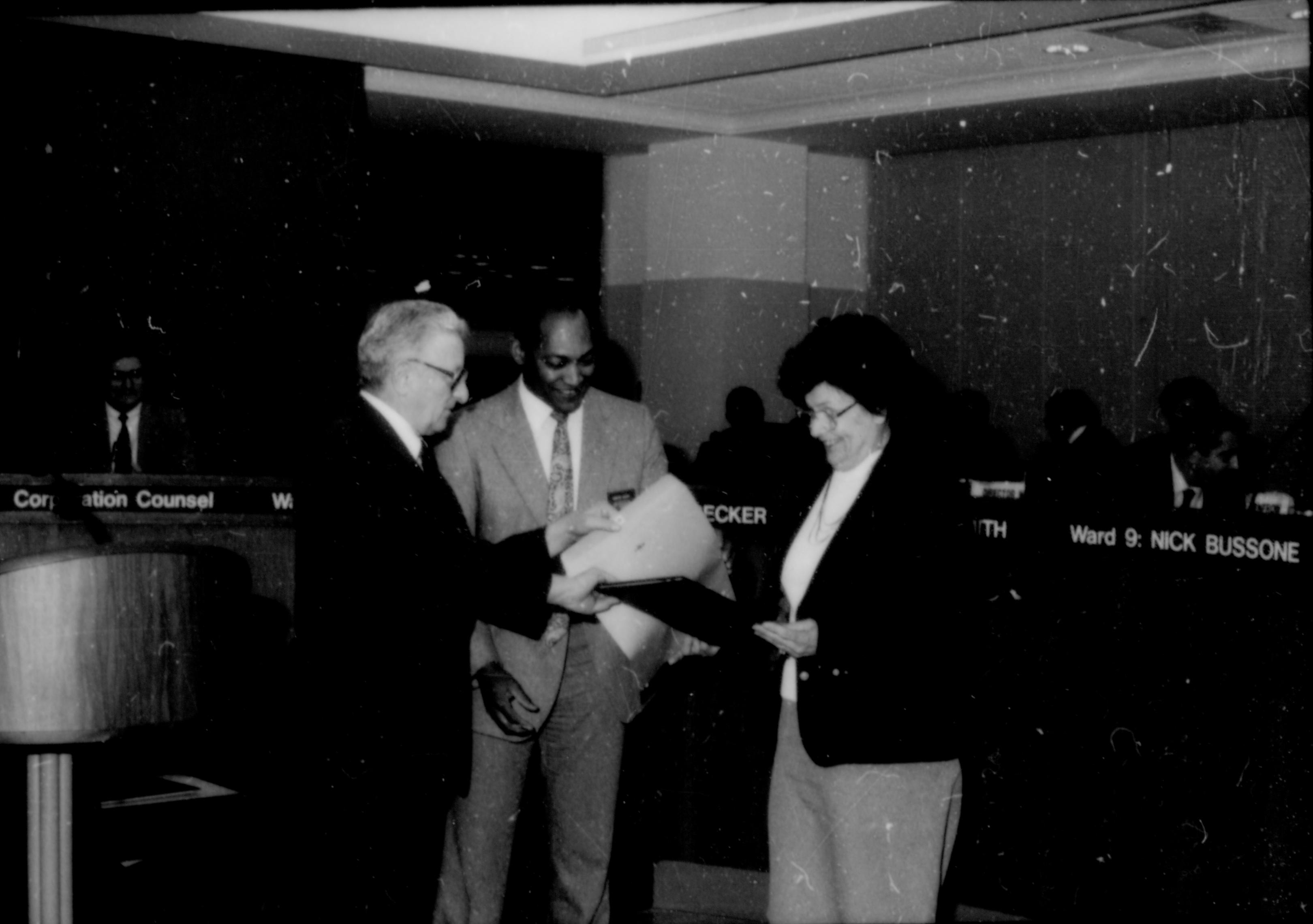 Two men giving award to a lady. Lincoln Home NHS- City Council Ollie Christmas Award, 133 Award, program