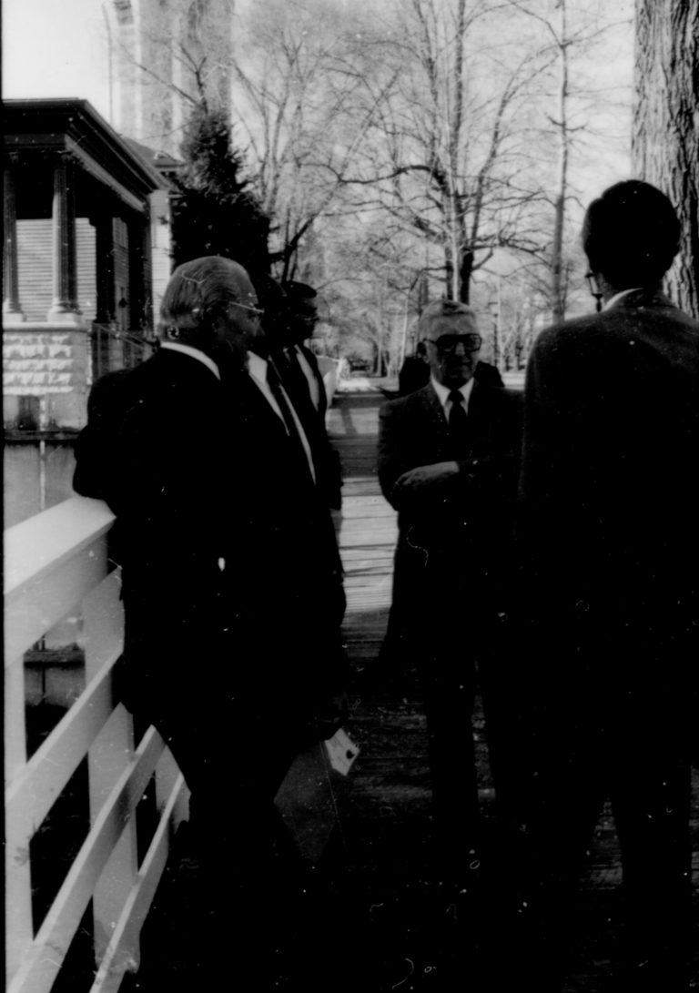 Four men standing and talking. Lincoln Home NHS- Paul Findley and Michel VIP visit, 115 Finley, Michel, tour, visit