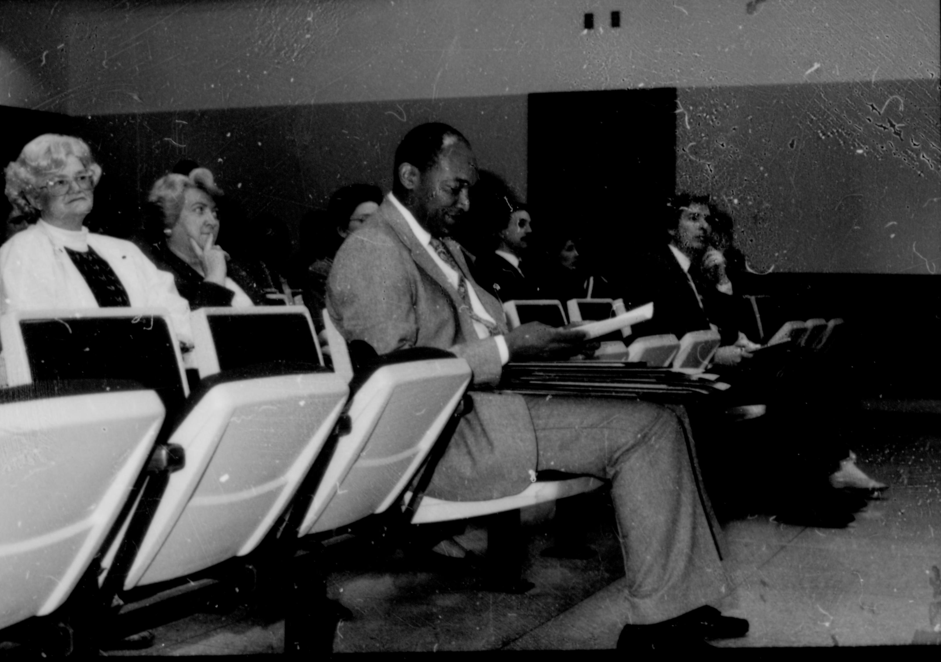 People seated in theater seats. Lincoln Home NHS- City Council Ollie Christmas Award, 133 Award, program