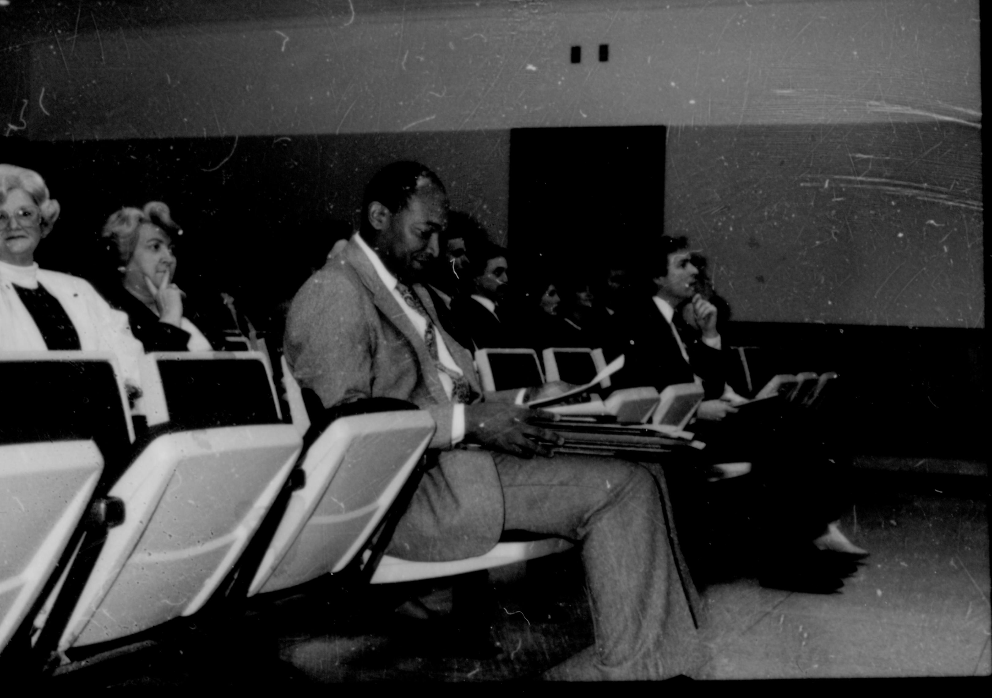 People seated in theater seats. Lincoln Home NHS- City Council Ollie Christmas Award, 133 Award, program