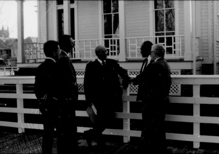 Men standing by white fence. Lincoln Home NHS- Paul Findley and Michel VIP visit, 115 Finley, Michel, tour, visit