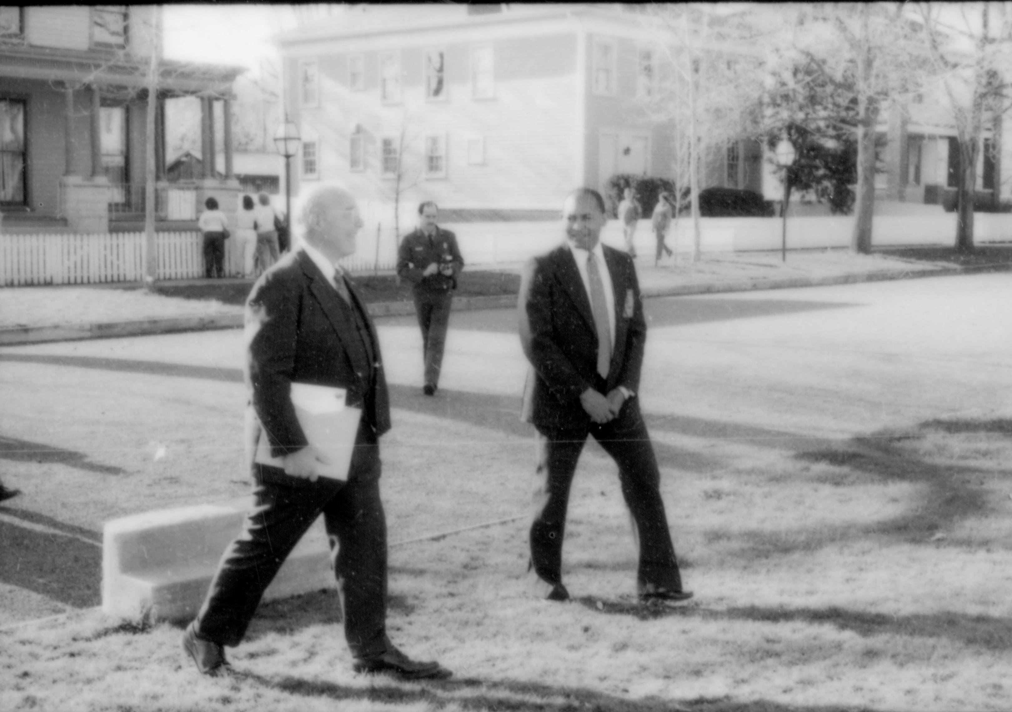 Two men in dark suits walking on boulvard. Lincoln Home NHS- Paul Findley and Michel VIP visit, 116 Finley, Michel, tour, visit