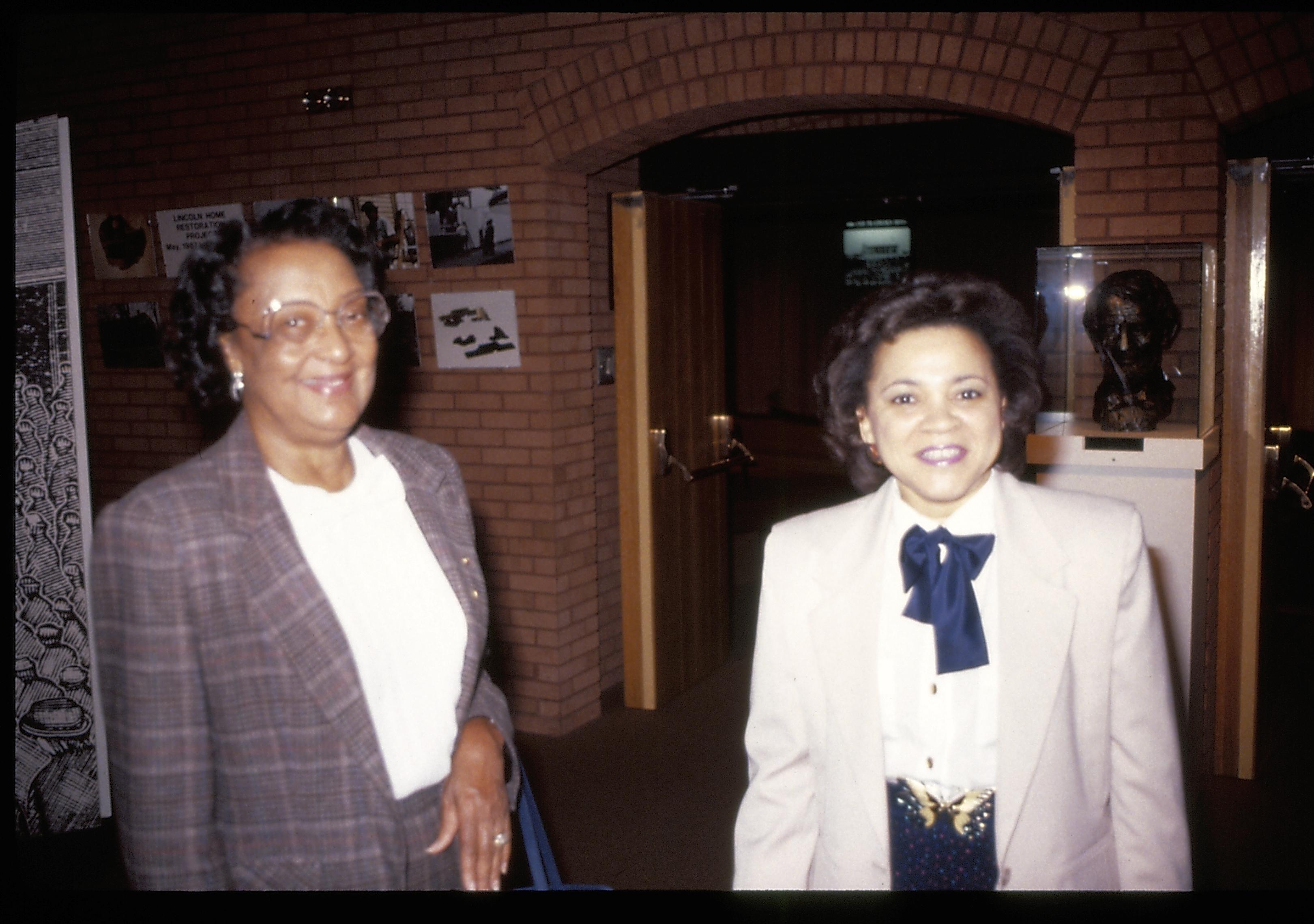 Two ladies standing outside VC theater. Lincoln Home NHS- VIP Findley and Michels Visit award, visit, ceremony