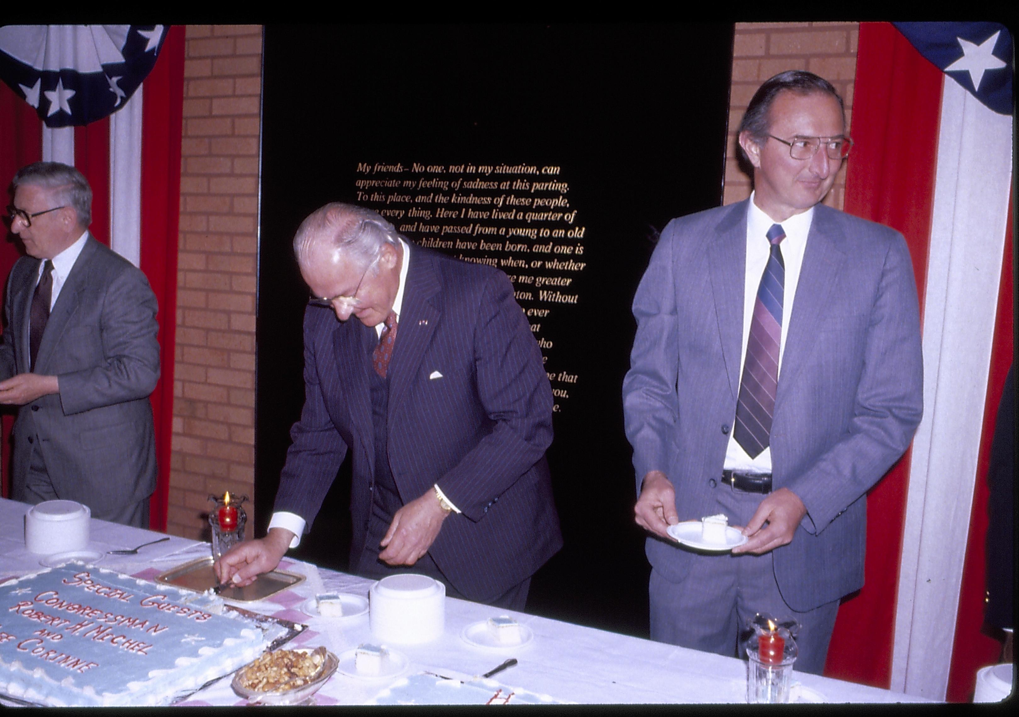 Man cutting piece of cake, two others in line. Lincoln Home NHS- VIP Findley and Michel Visit award, visit, reception