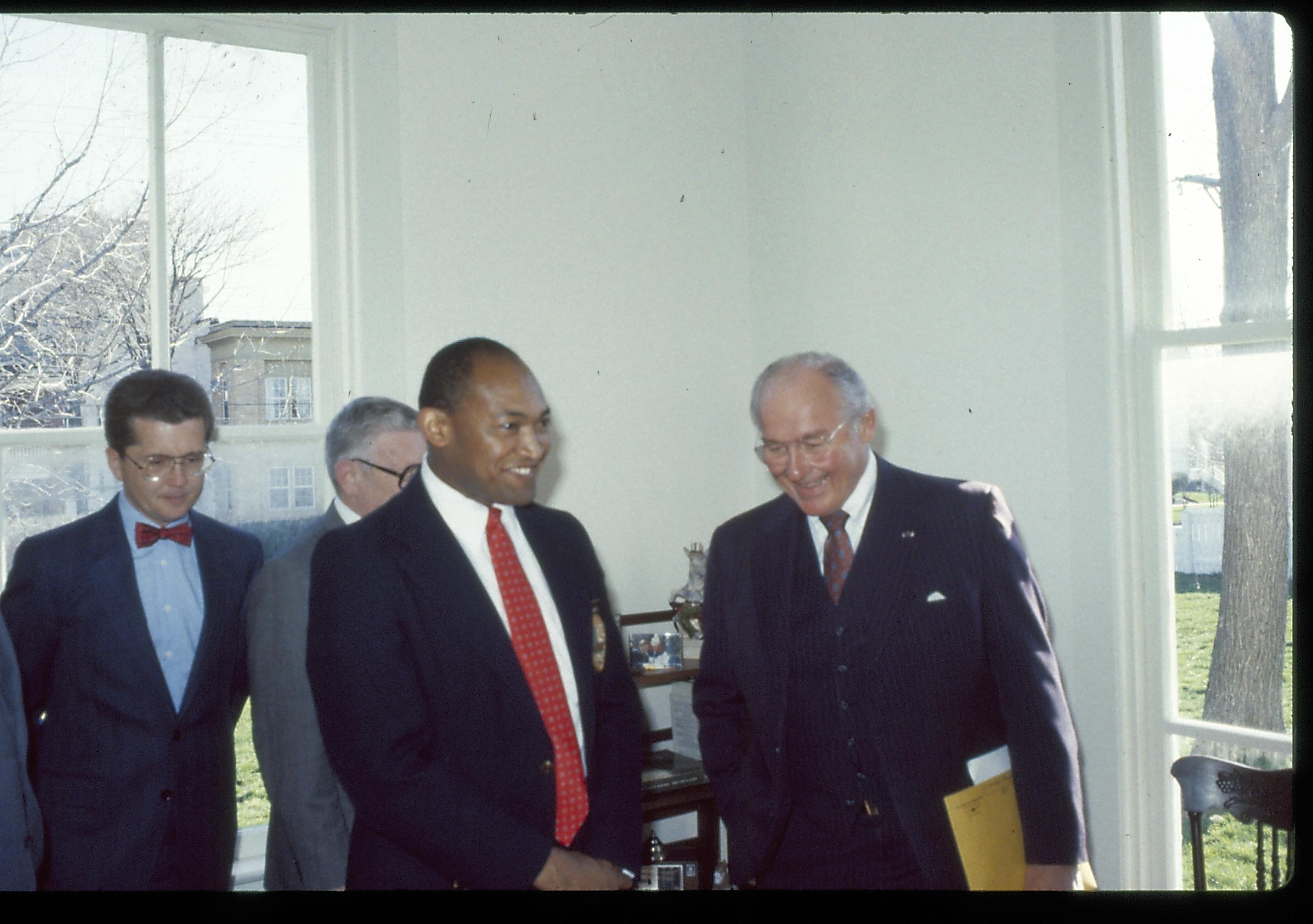 Four men standing in corner of a room. Lincoln Home NHS- VIP Findley and Michel Visit award, visit, tour