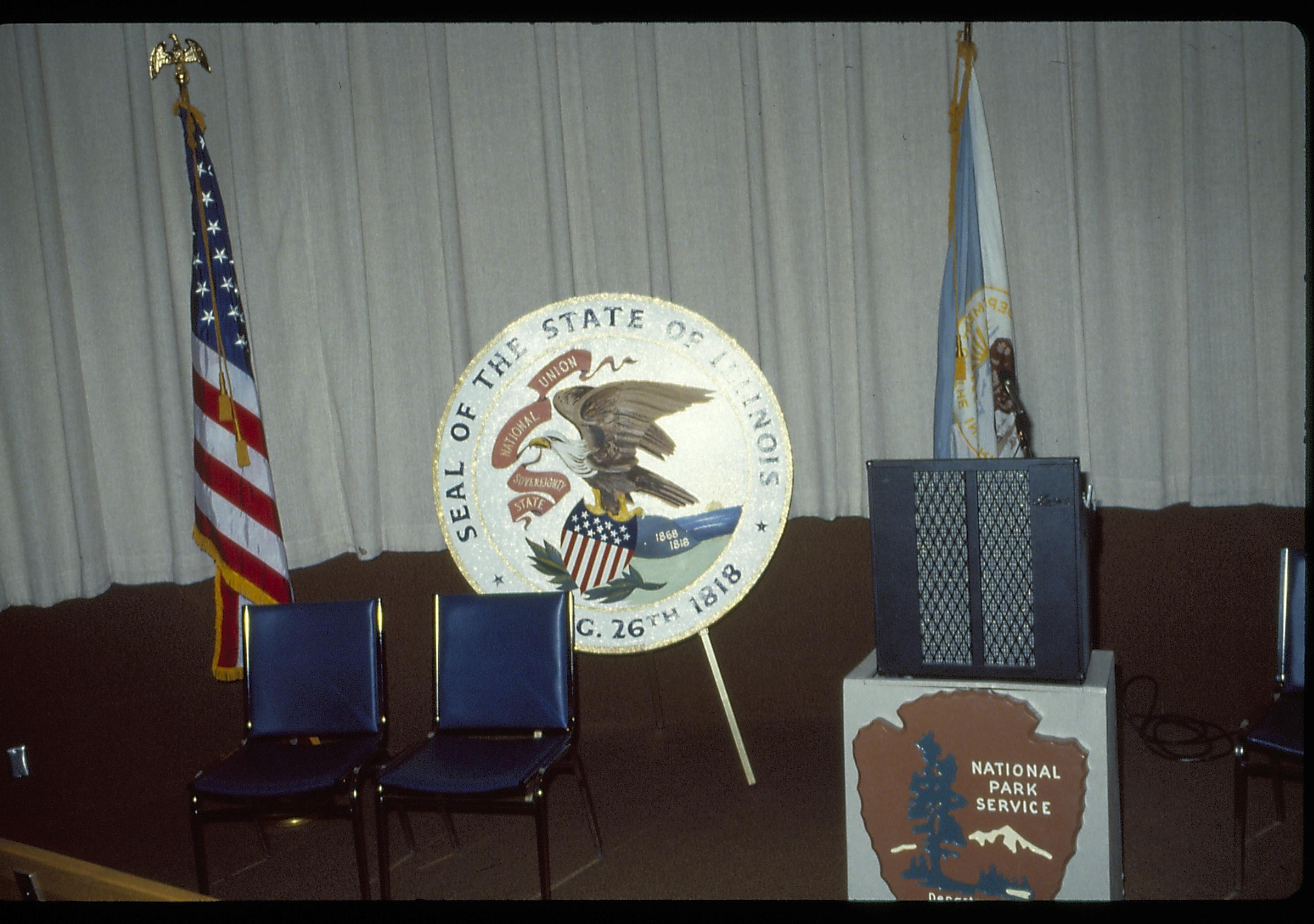 State seal and speakers set up in VC theater. Lincoln Home NHS- VIP Findley and Michel Visit award, visit