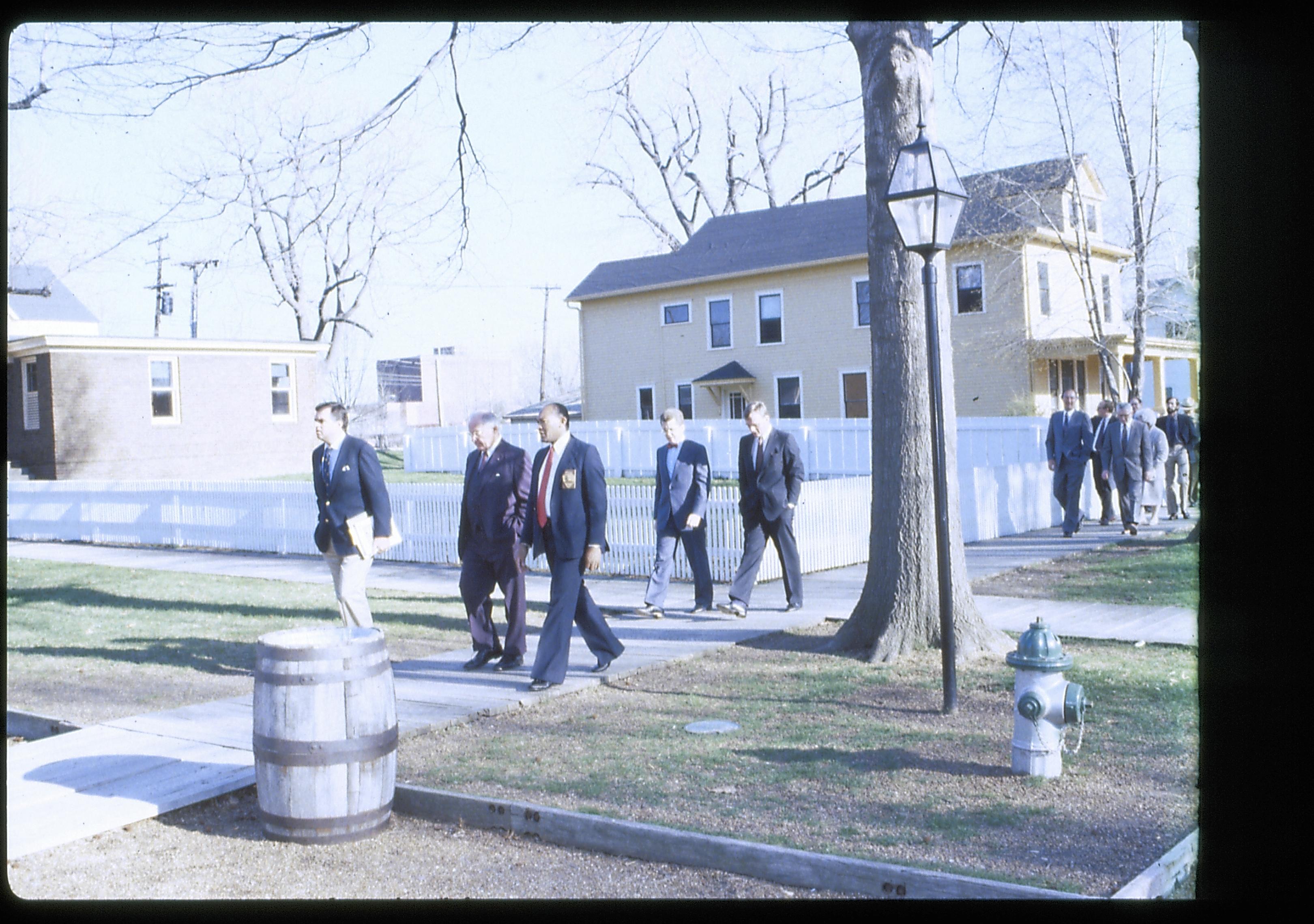 Men walking on board walk in front of Arnold house. Lincoln Home NHS- VIP Findley and Michel Visit award, visit, tour