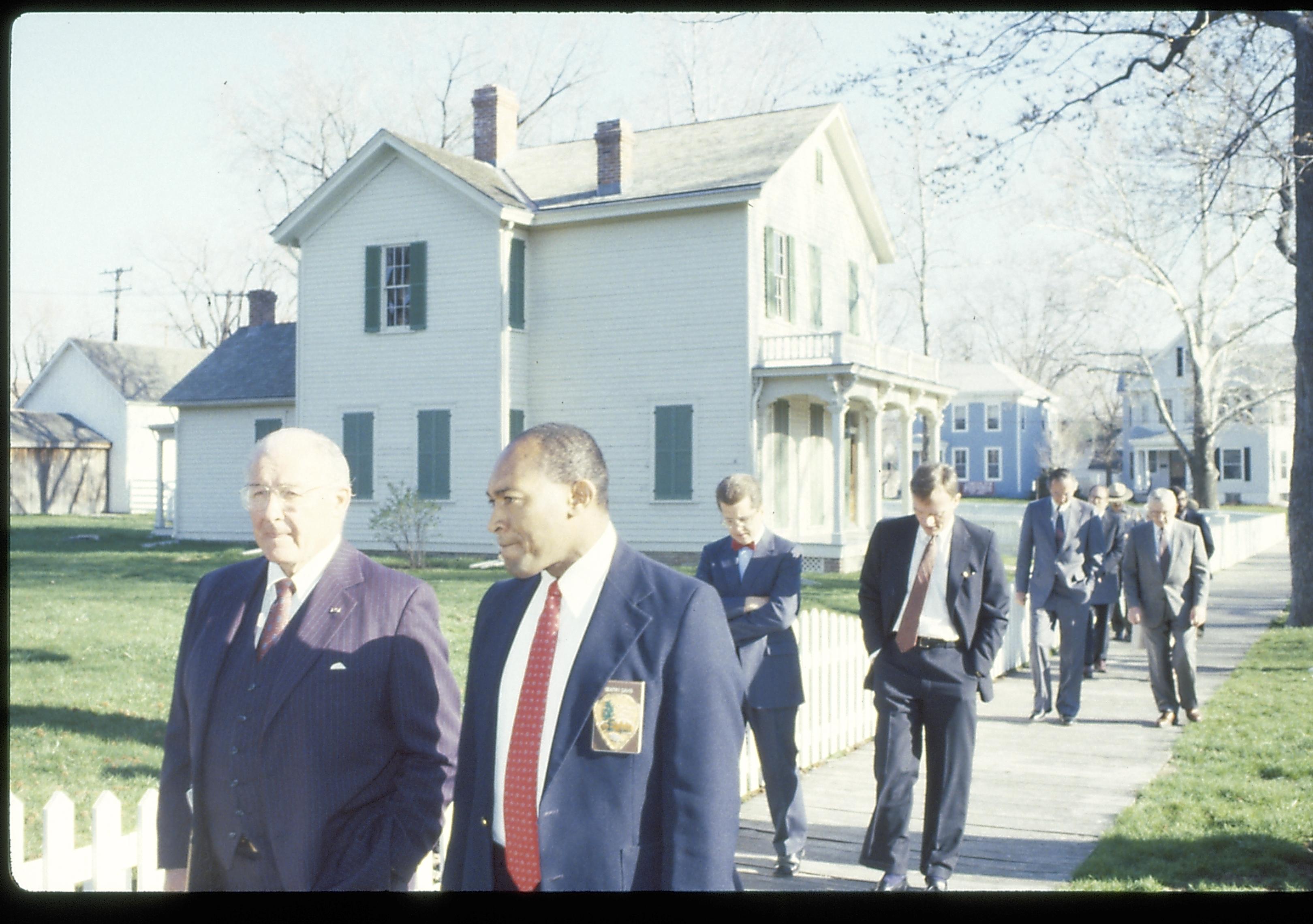 Men walking down board walk by Robinson house. Lincoln Home NHS- VIP Findley and Michel Visit award, visit, tour