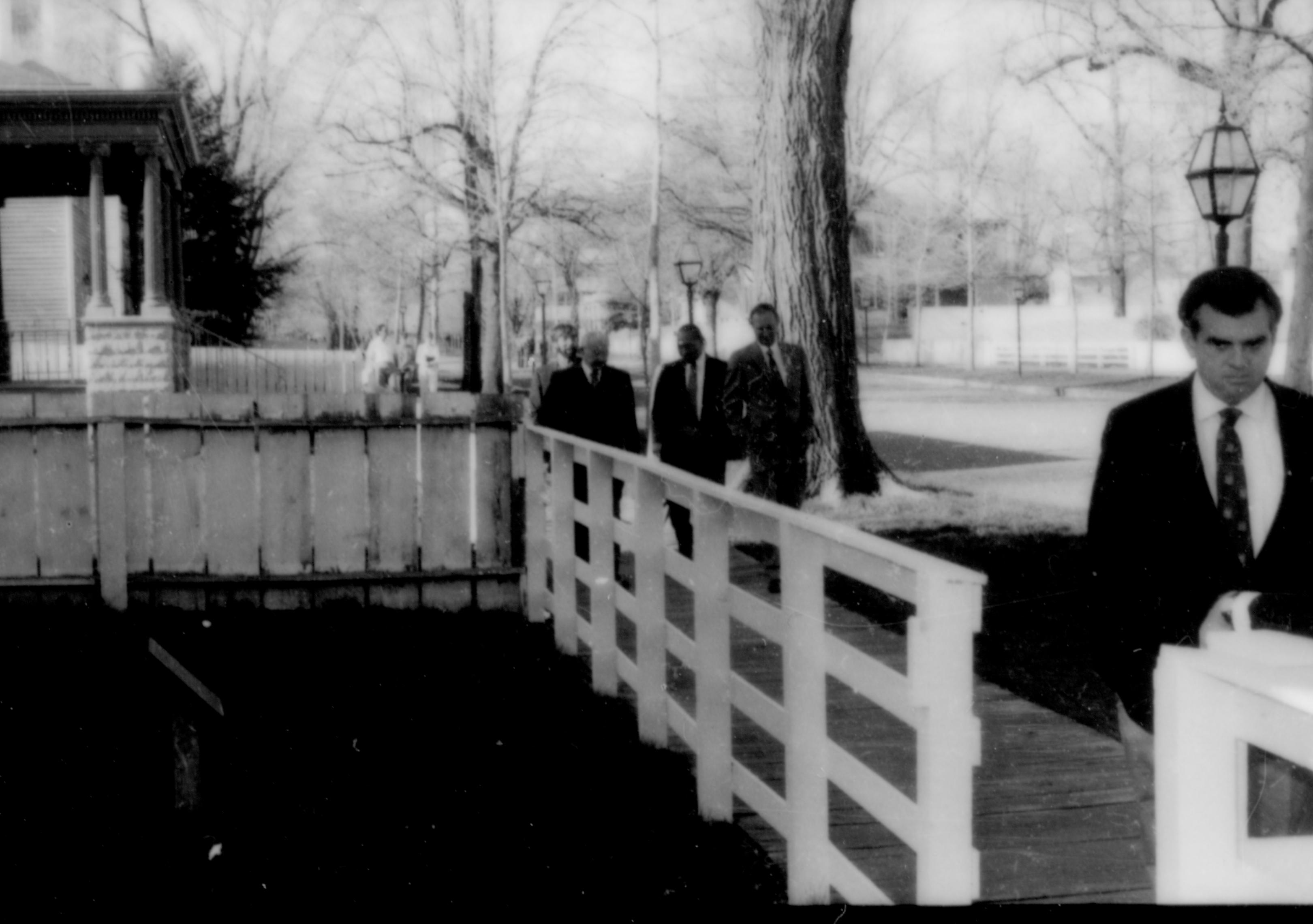 Man walking down board walk. Lincoln Home NHS- Paul Findley and Michel VIP visit, 115 Finley, Michel, tour, visit