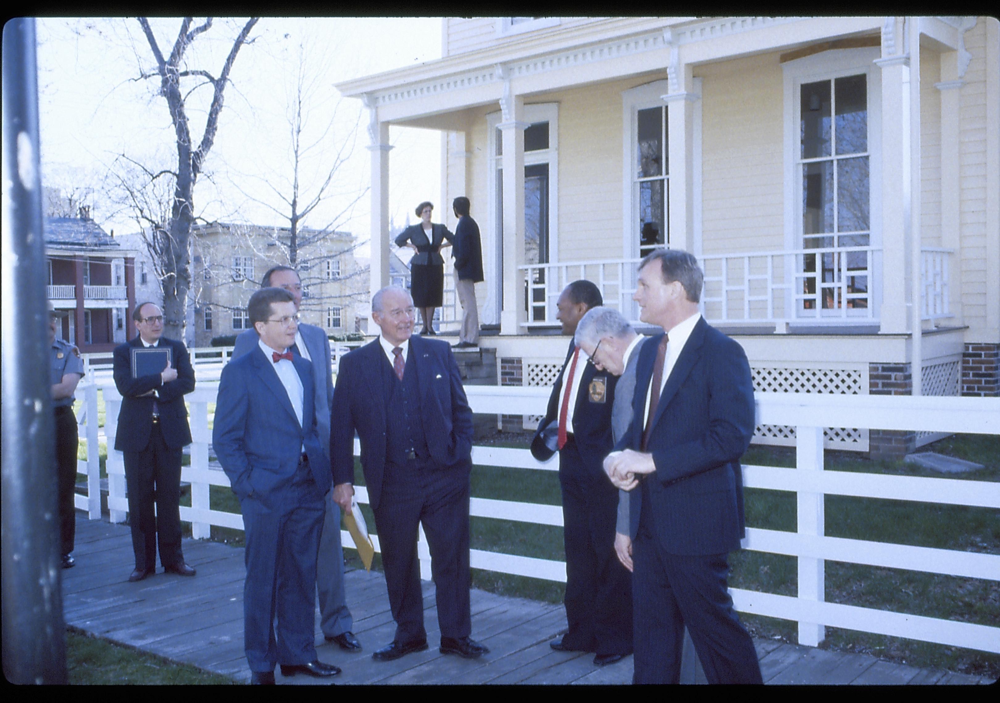 Group of men standing on board walk in front  of white fence. Lincoln Home NHS- VIP Findley and Michel Visit award, visit, tour