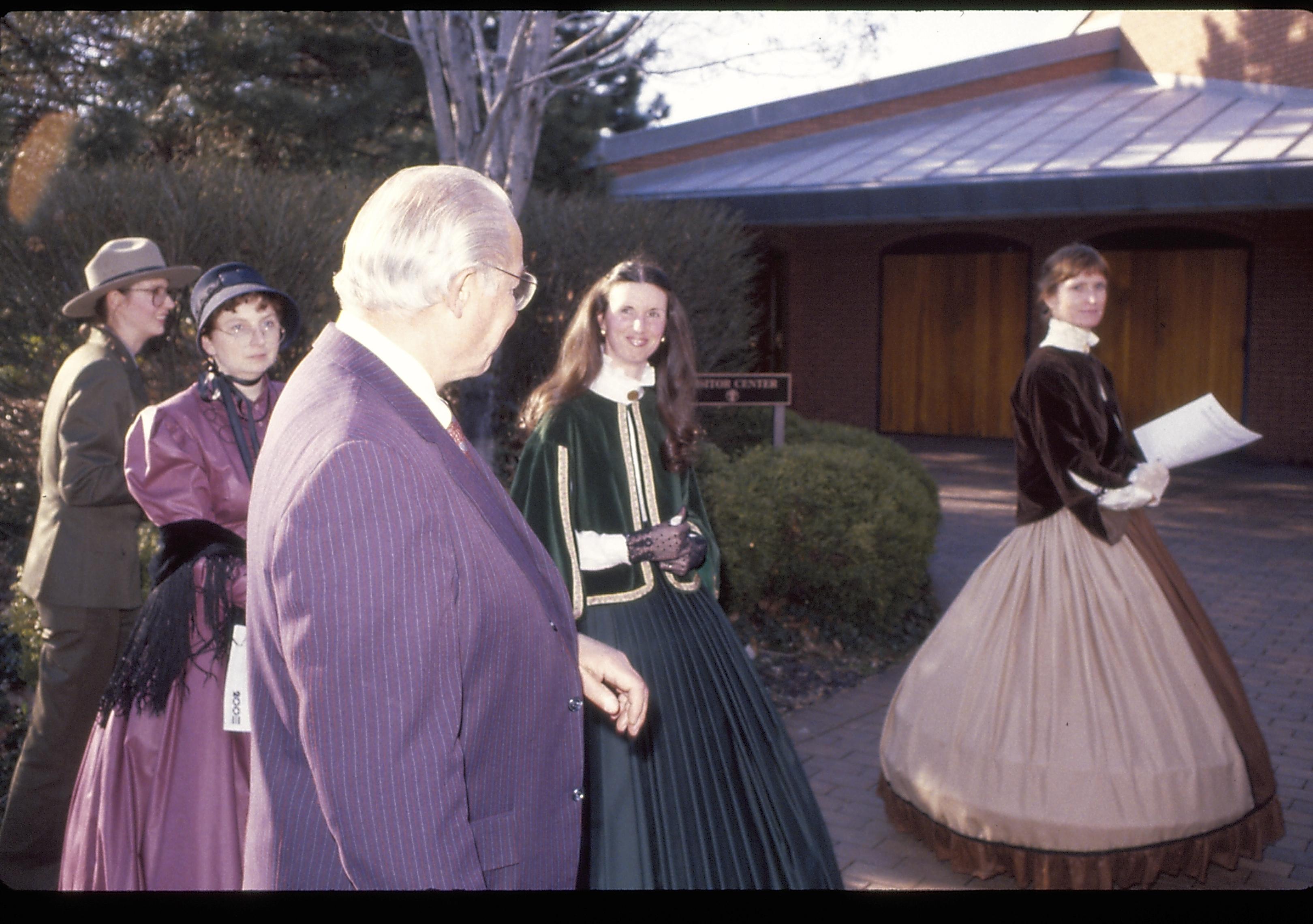 Ranger, three ladies in period dress and a man outside VC. Lincoln Home NHS- VIP Findley and Michel Visit award, visit