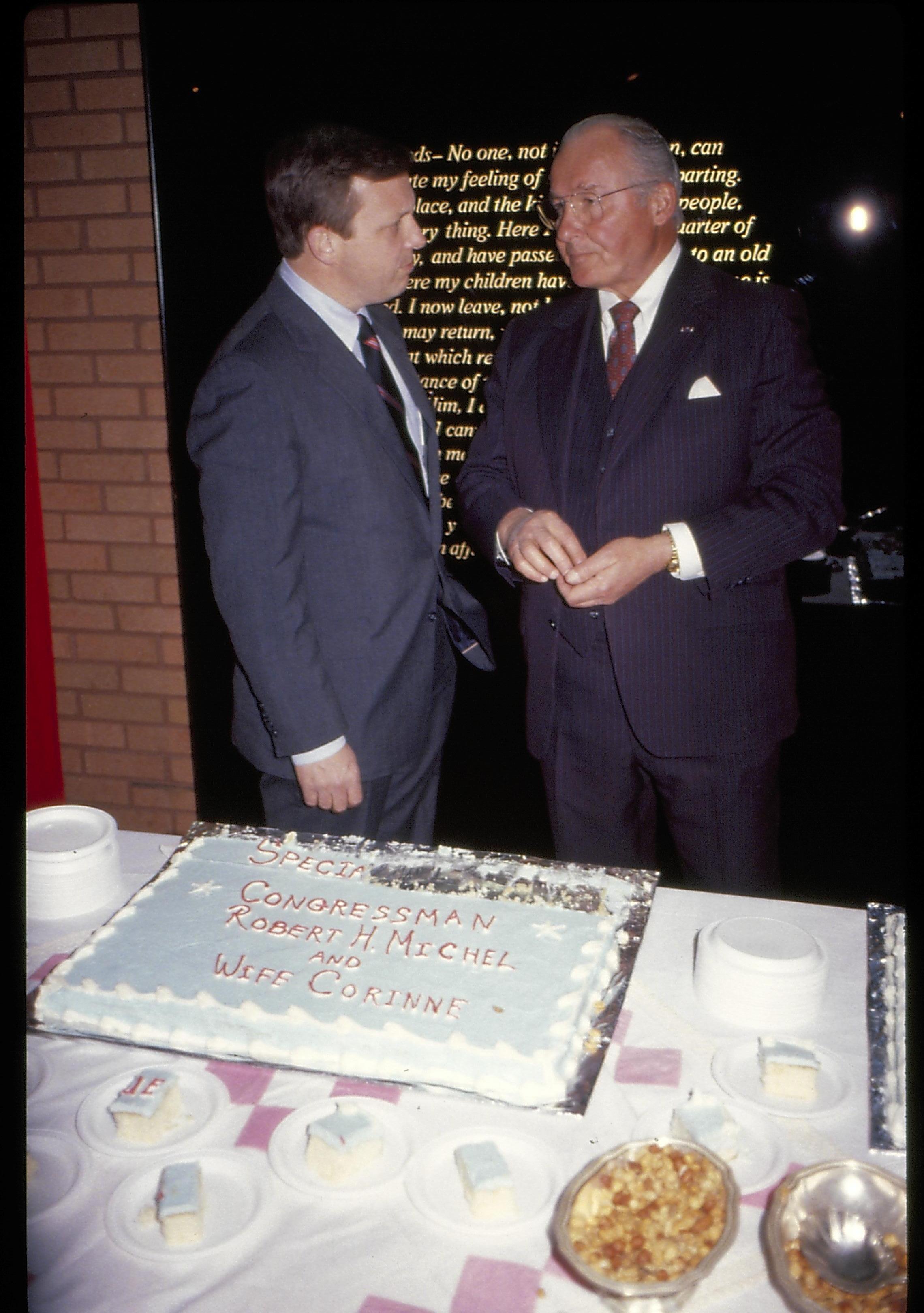 Two men talking standing in front of farewell address sign. Lincoln Home NHS- VIP Findley and Michel Visit award, visit, reception