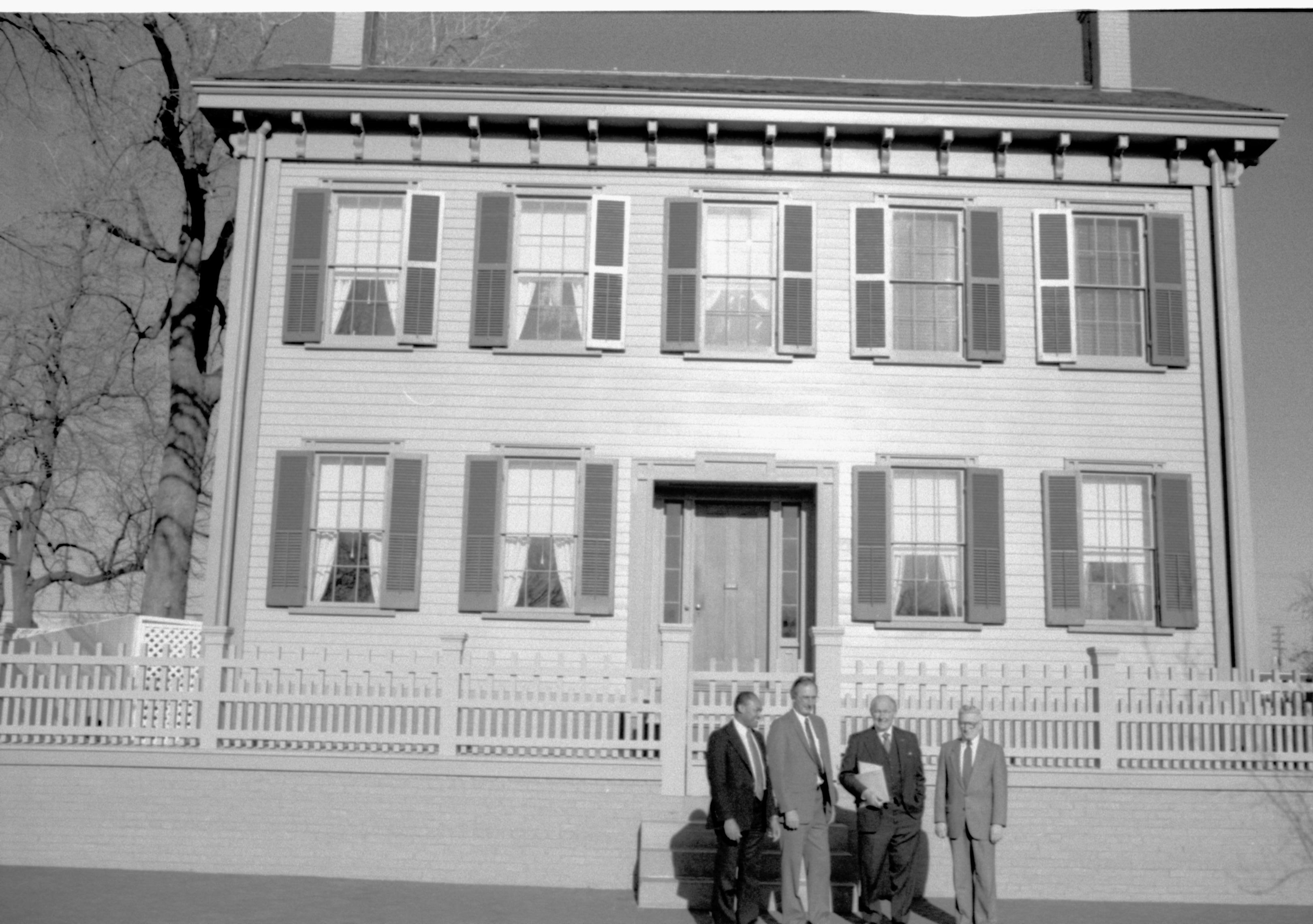 Four men standing in front of Home. Lincoln Home NHS- VIP Findley and Michel Visit, 66A award, visit, tour