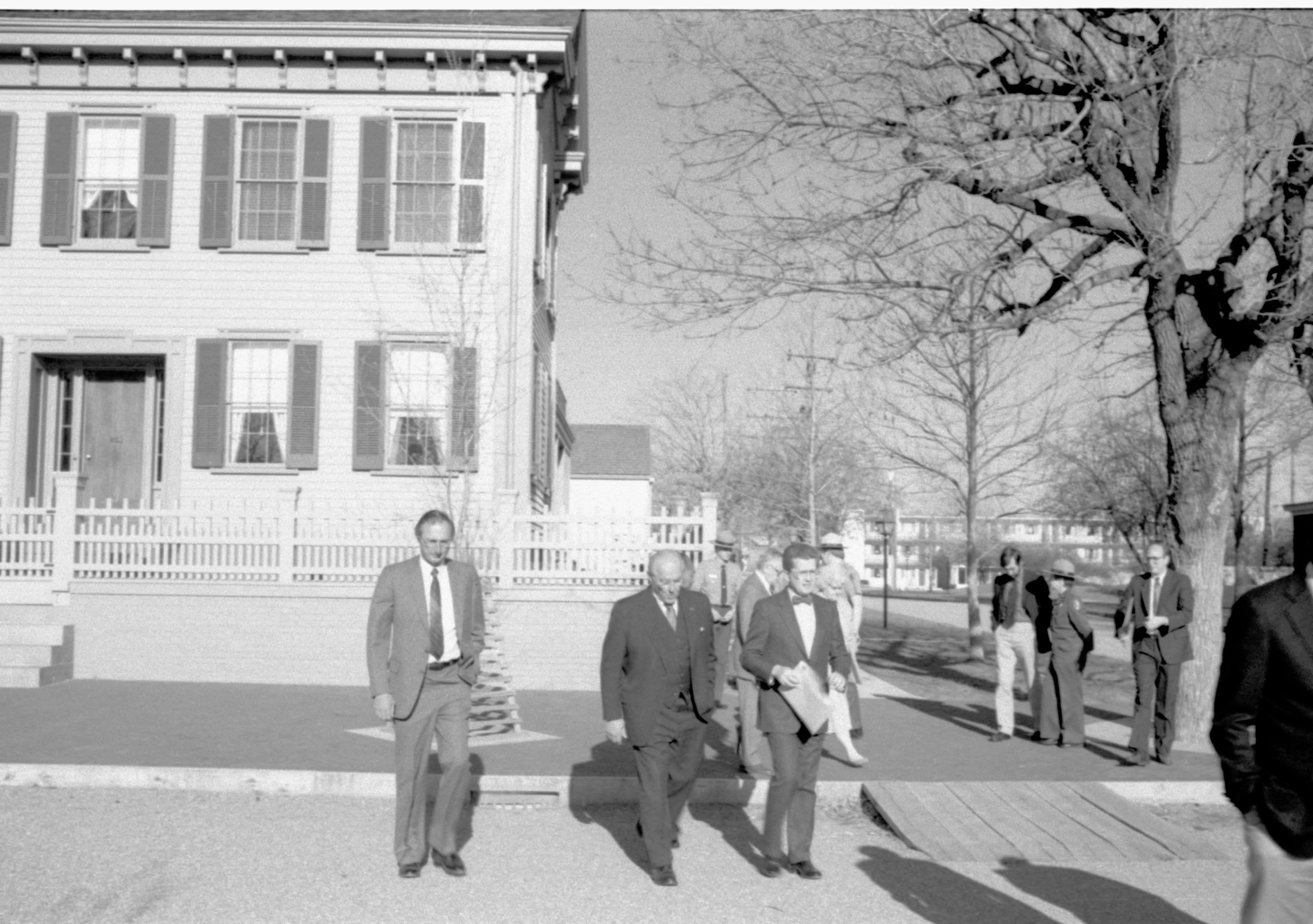 Three men crossing street. Lincoln Home NHS- VIP Findley and Michel Visit, 66A award, visit, tour