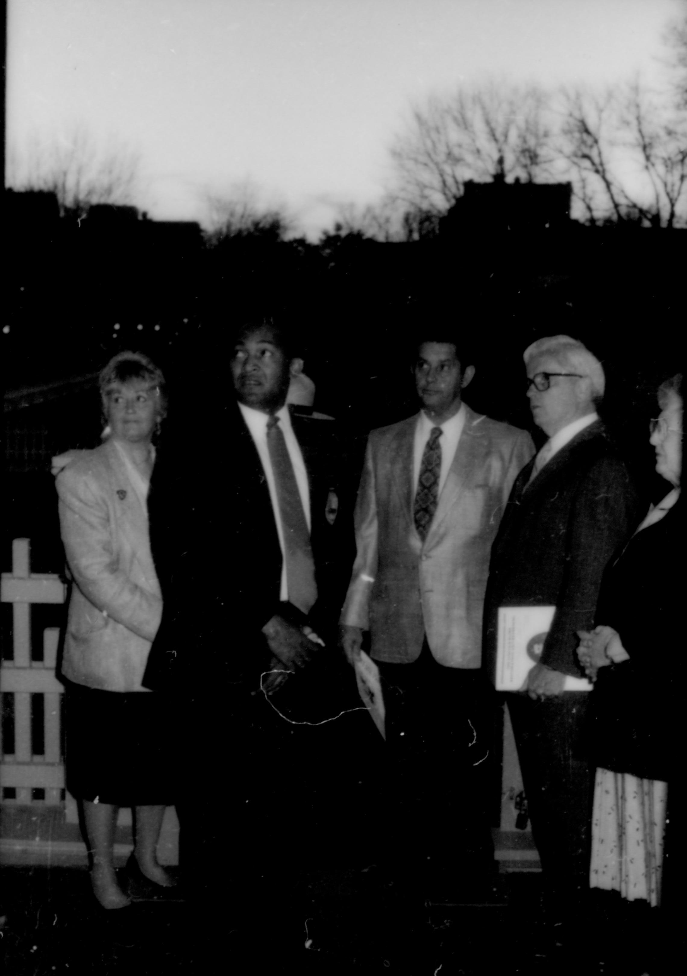 Five people standing, looking at something. Lincoln Home NHS- Paul Findley and Michel VIP visit, 117 Finley, Michel, visit, tour