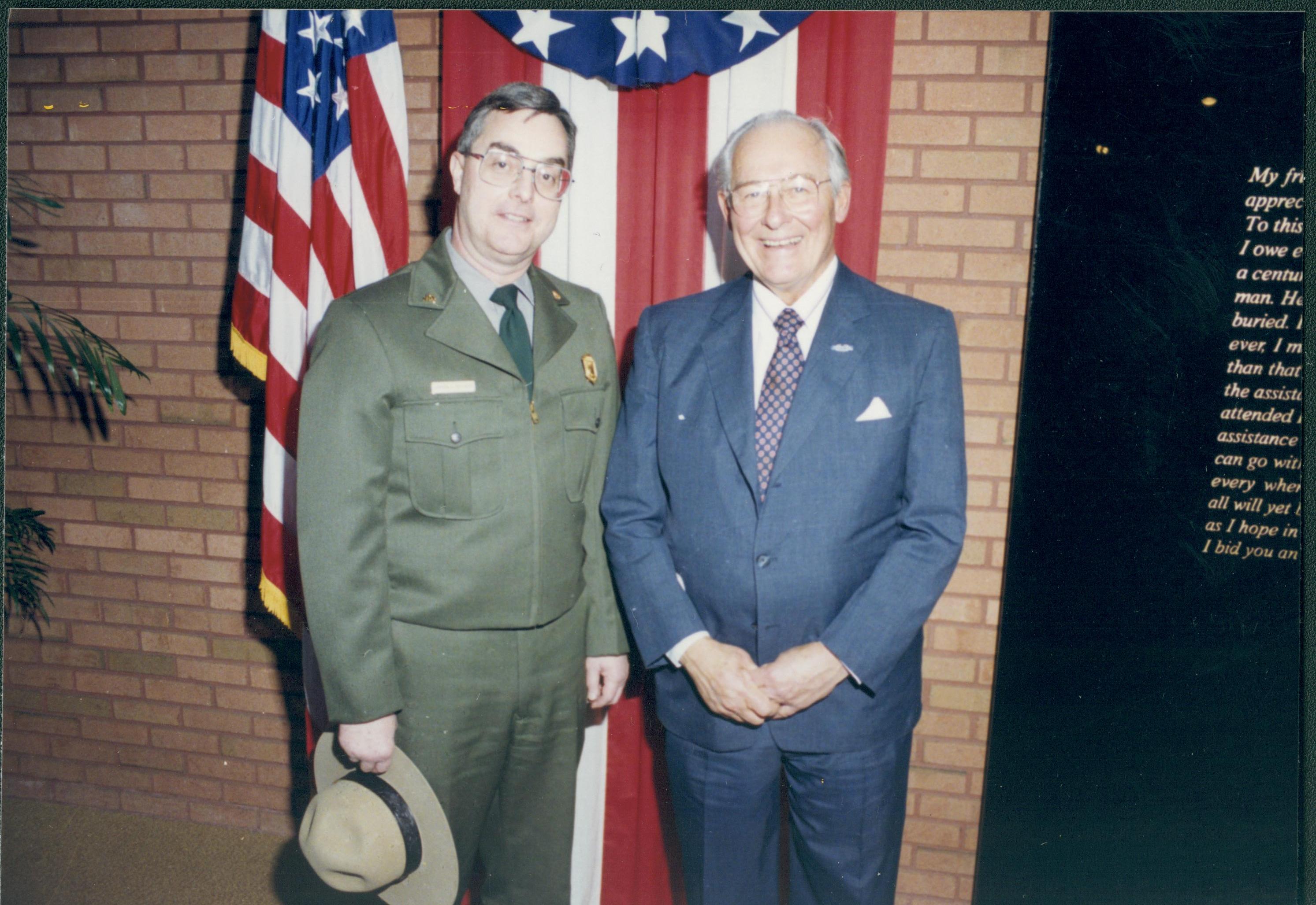 Ranger and man standing in front of bunting. Lincoln Home NHS- VIP Findley and Michel Visit visit, program