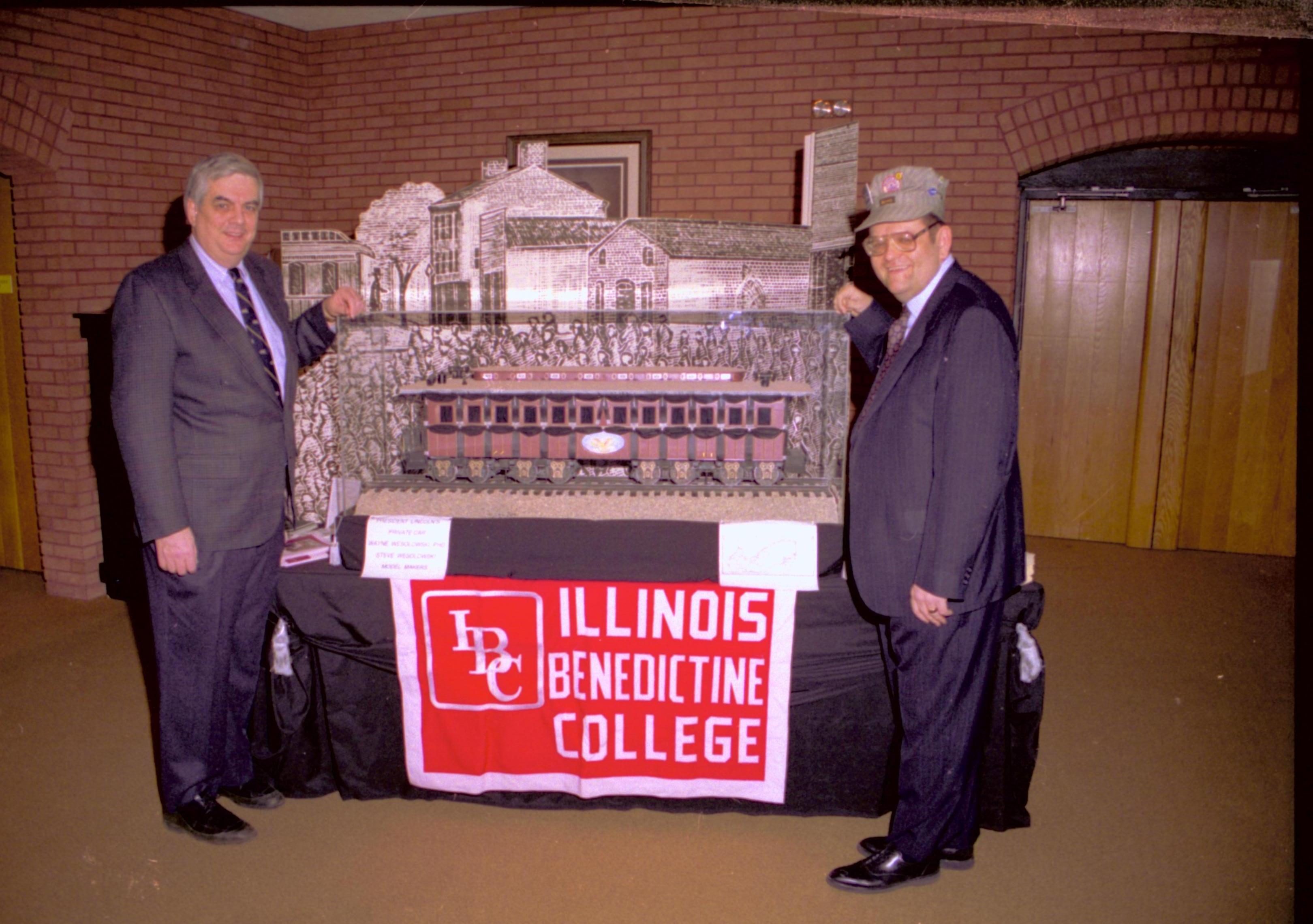 Two men standing in front of funeral car exhibit. Lincoln Home NHS- VIP Findley and Michel Visit to Lincoln Home visit, program, display