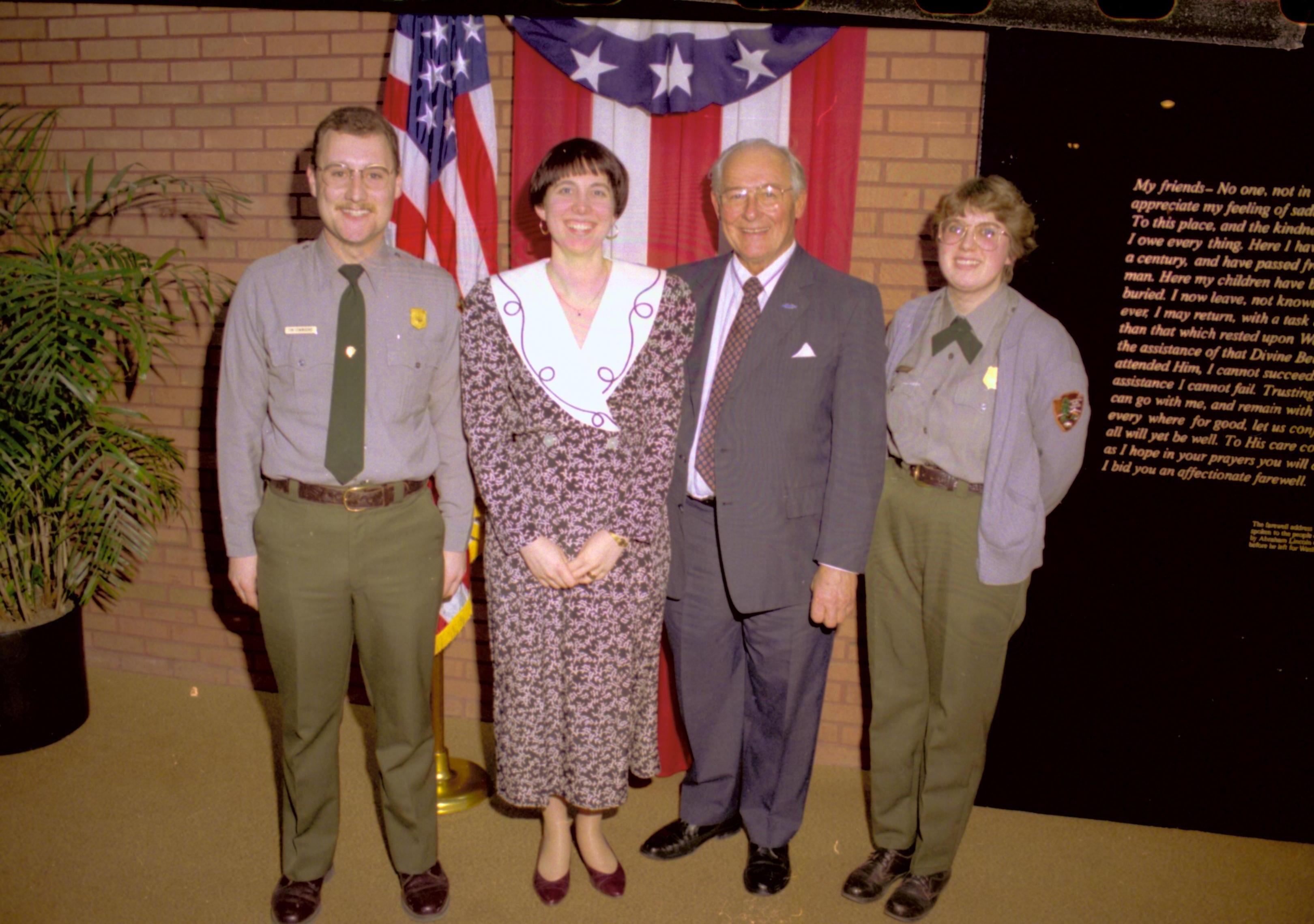 Group posing in front of American flag & bunting. Lincoln Home NHS- VIP Findley and Michel Visit to Lincoln Home visit, program